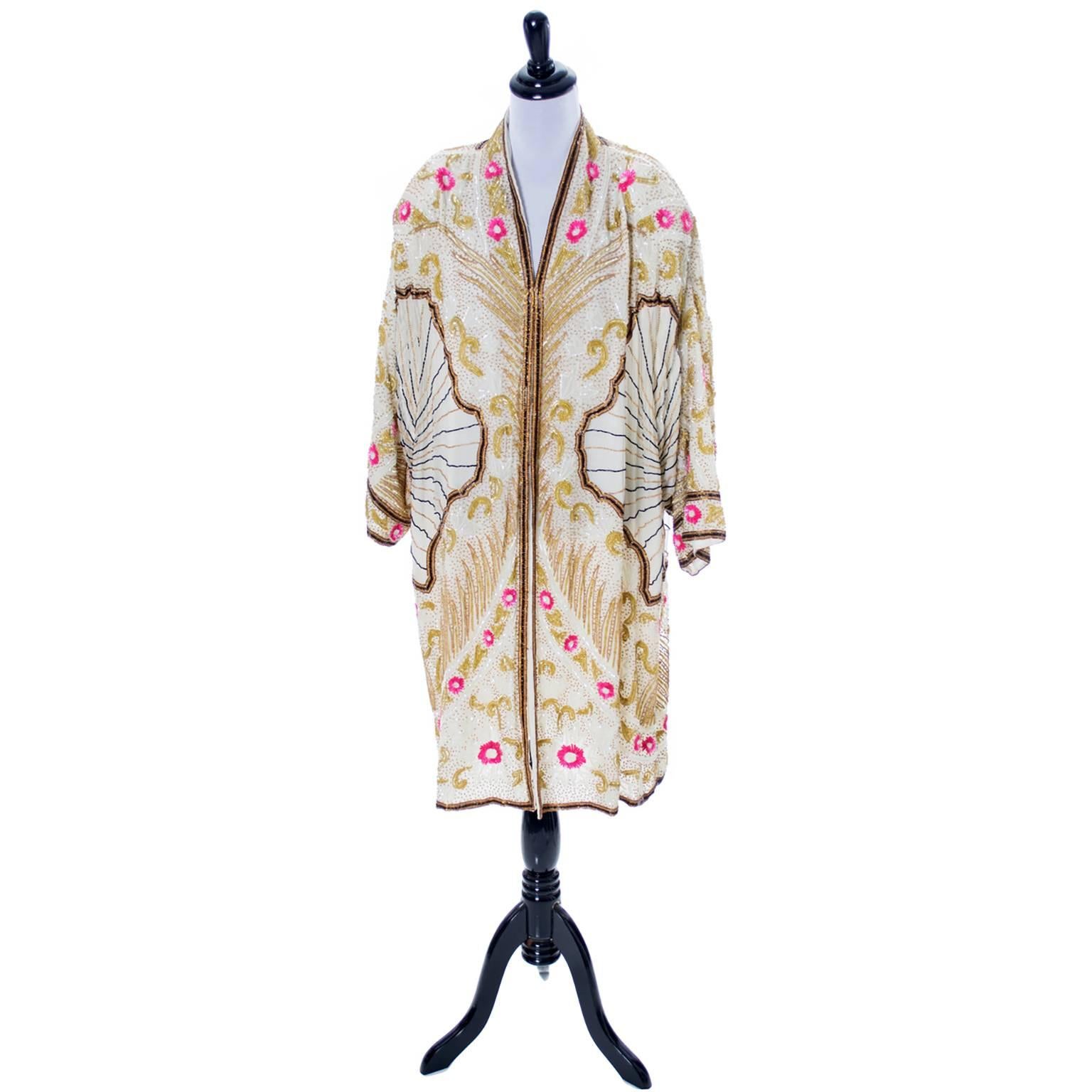 This incredible vintage Birjand Gunit heavily beaded evening coat was purchased in the 1980's but is similar in style to the beaded coats that flappers wore in the 1920's. The coat has rayon lining and measures  39