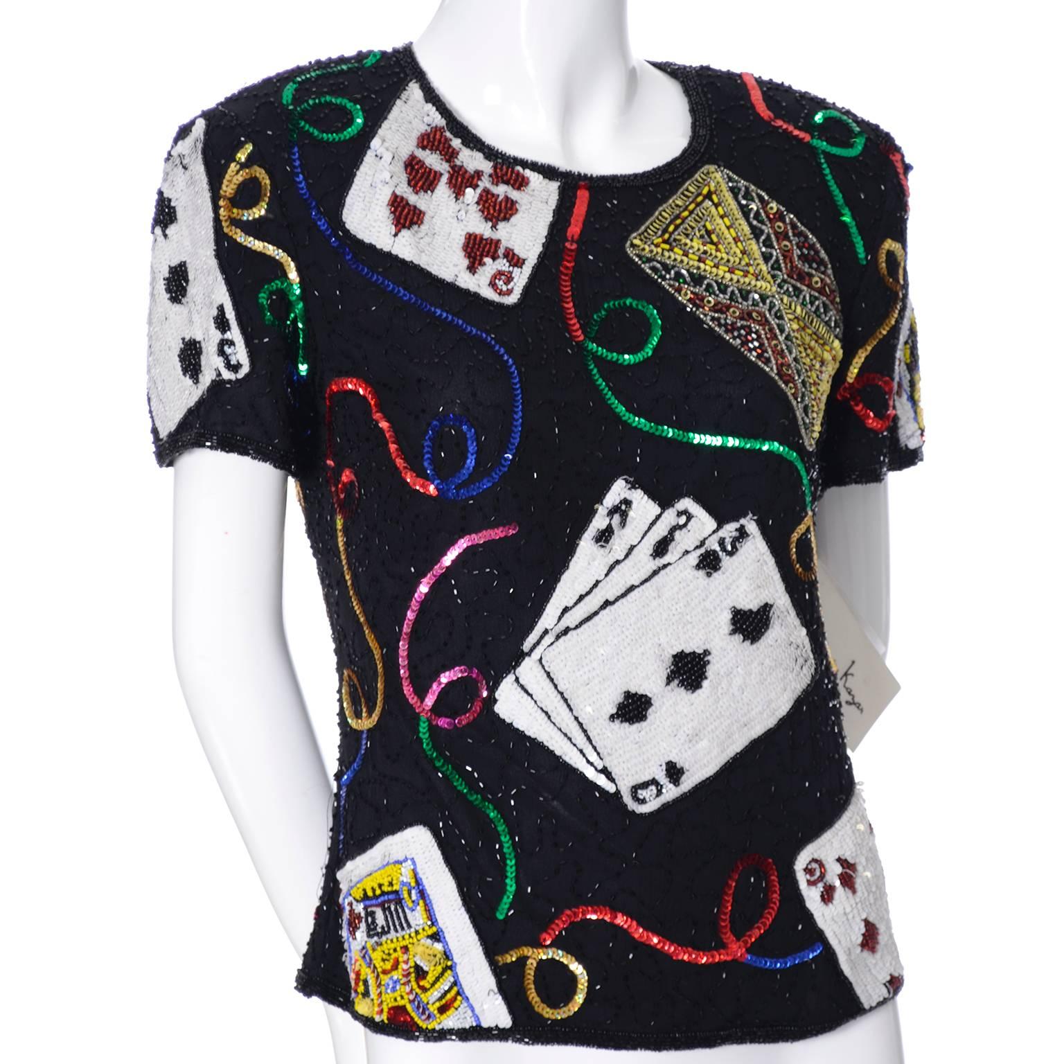This is a deadstock novelty vintage top from Laurence Kazar, covered in beads and sequins.  There are playing cards and ribbon curls, as well as other pretty embellishments.  This top is fully lined and has a back zipper and there are only a few