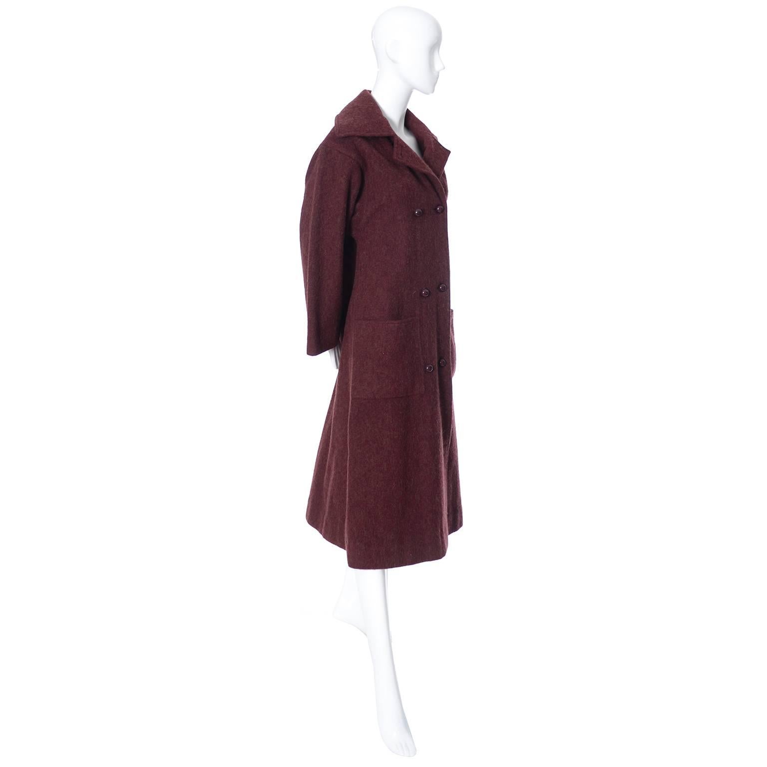 This is an outstanding double breasted vintage coat from Givenchy in a burgundy alpaca wool blend. This coat is the perfect coat for your winter wardrobe this year! Fully lined in luxuriously satin, this vintage Givenchy soft burgundy coat has