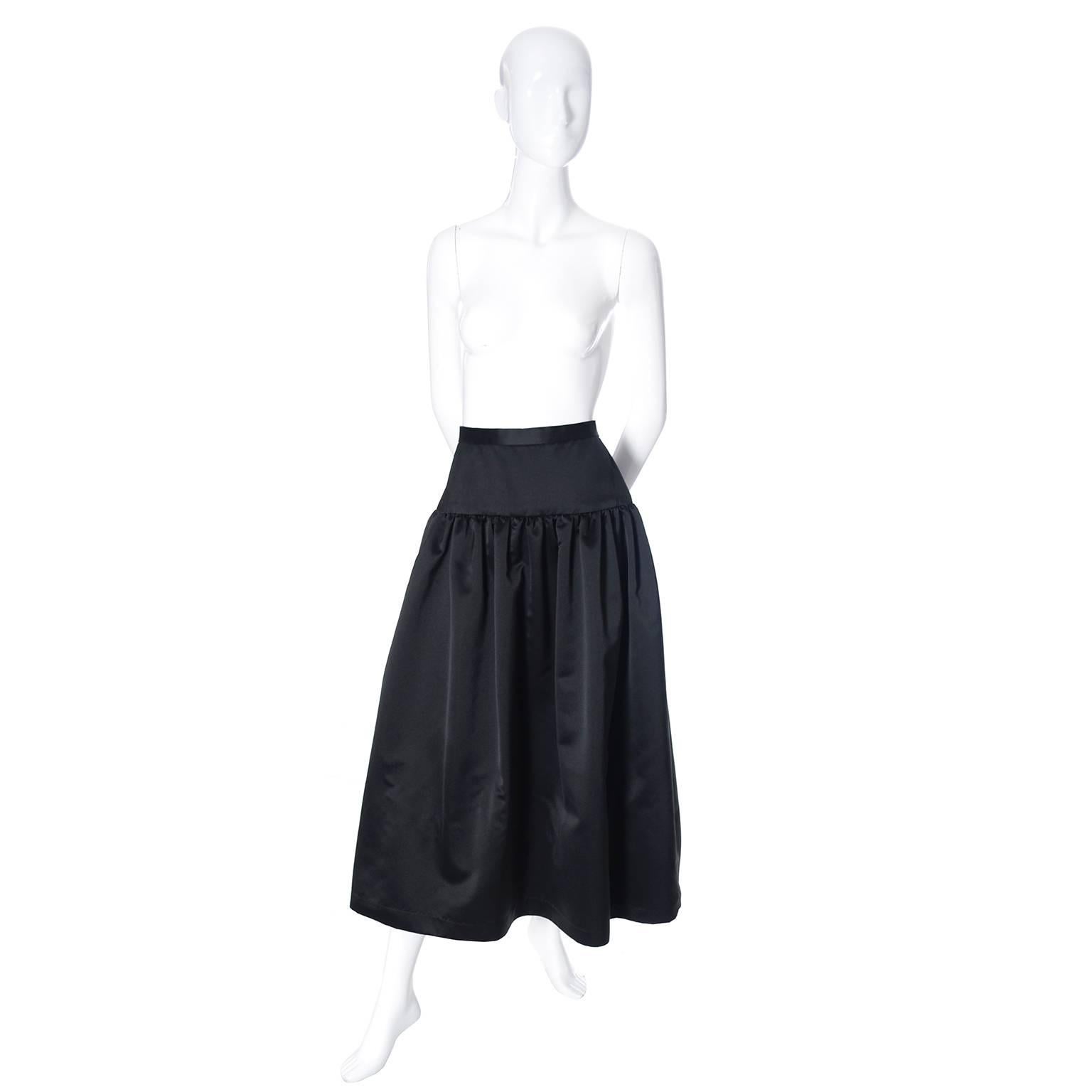 This is a pristine black satin skirt from Anthony Muto for Moroci. The skirt is labeled a size 10 but please use the measurements as the best guide to a proper fit.  The skirt has a fabulous built in under skirt with a ruffled hem that adds volume. 