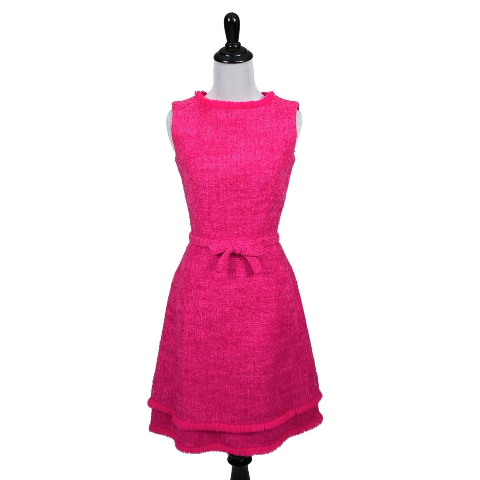 This is a simply perfect hot pink classic late 1960’s vintage sleeveless tweed dress with a beautiful double hemline. This Lanz Original dress has pretty fringe, a 20” back zipper and 2 hooks and eyes at the neck. The dress has a fabric belt and a