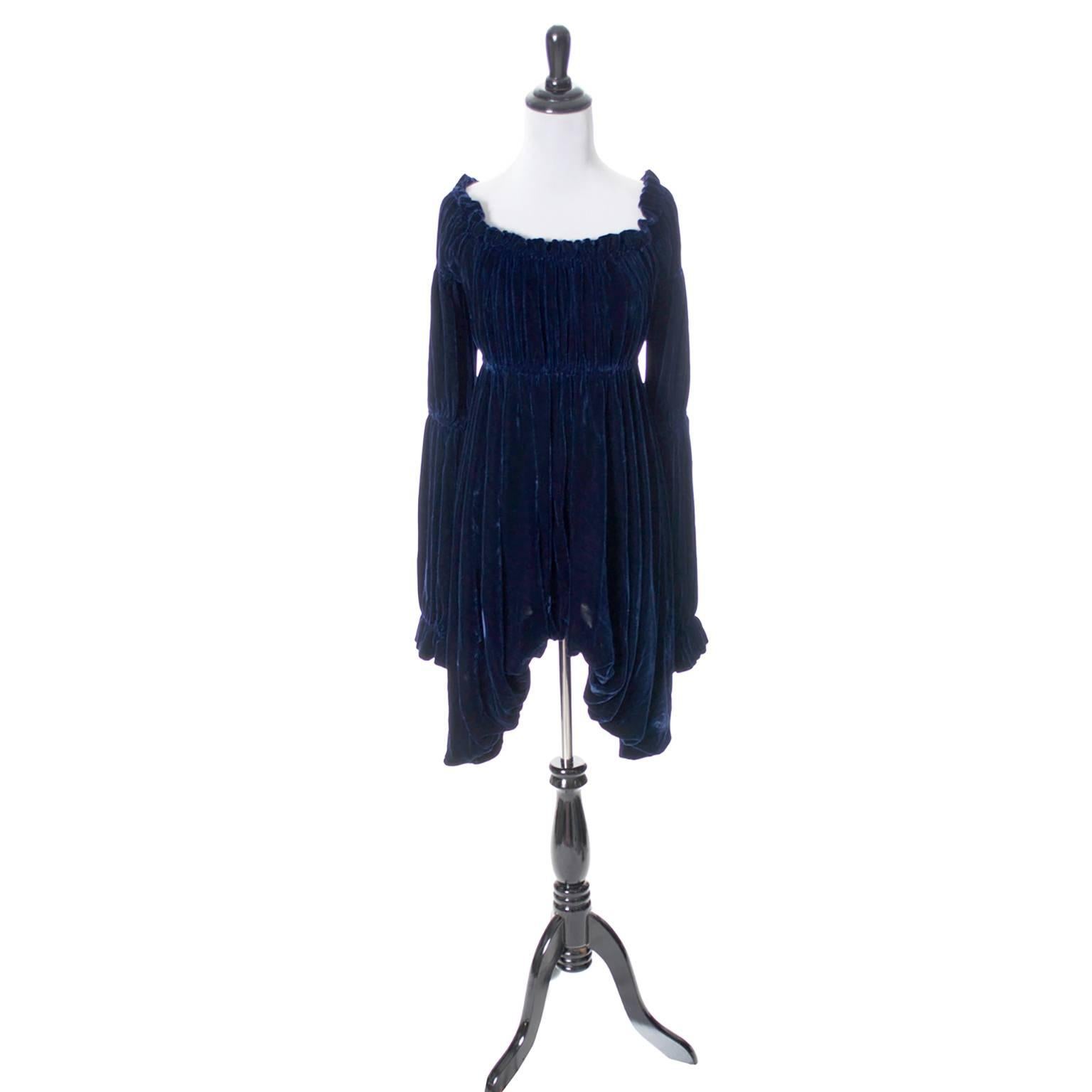 This is an extraordinary 1980's vintage dress from Norma Kamali. This avant garde rayon and silk vintage midnight blue velvet dress has a lined skirt portion and elastic gathering at the empire waist line. I particularly love the Elizabethan poet