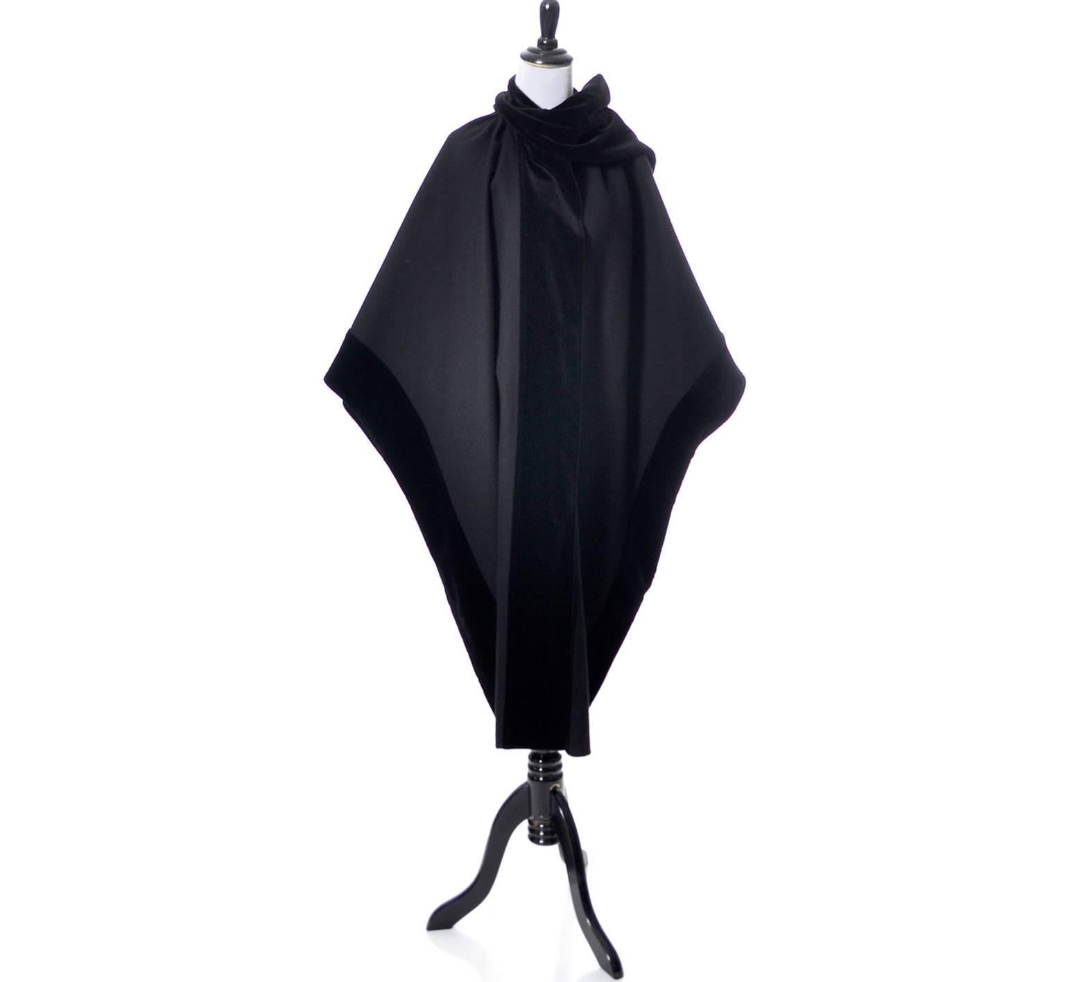 This is a sensational vintage cape from Ferragamo in black wool with black velvet trim.  I love the way the velvet wraps around the neck like a scarf on one side.  Though this is shaped like a cape, it does actually have wide sleeves.  The cape is
