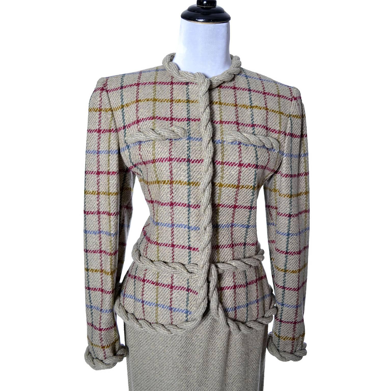 This is a beautiful vintage Valentino 2 piece suit with slim skirt and fitted blazer with shoulder pads. This suit includes a pale taupe heathered tweed wool skirt with coordinating windowpane plaid blazer in taupe, burgundy, gold and blue with