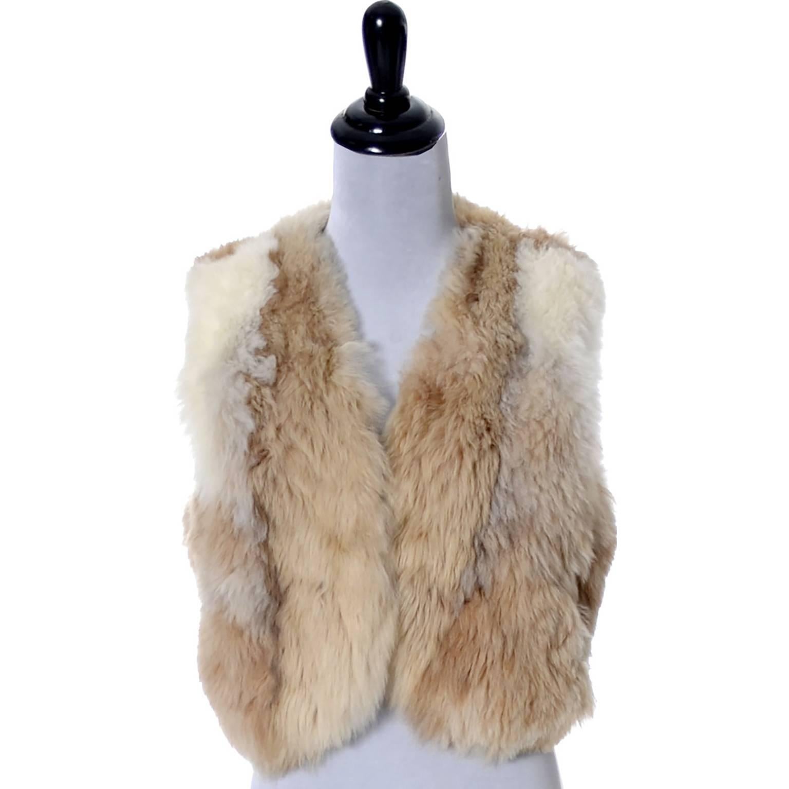 This is an incredibly soft late 60's or early 1970's vintage fur vest from Highlands Alpaca Furs.  This is a very thick, plush, alpaca fur vest with side slit pockets and pretty chocolate brown satin lining. This vest fits up to a size 36 bust if