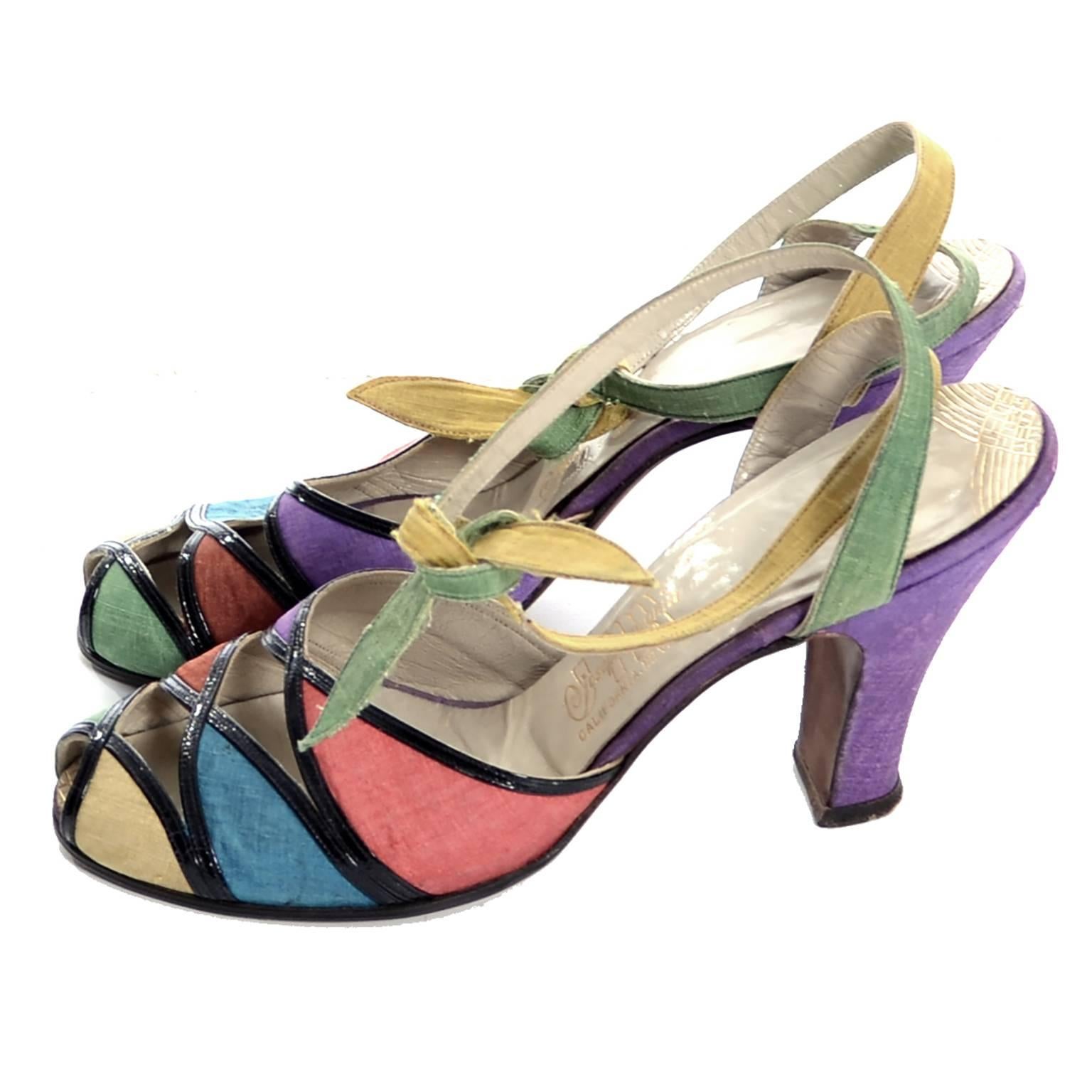These are absolutely exceptional vintage 1940's multi colored silk and black leather peep toe shoes with ankle straps that tie.  These are some of my personal favorite vintage shoes and they come from an estate that was my favorite estate of vintage