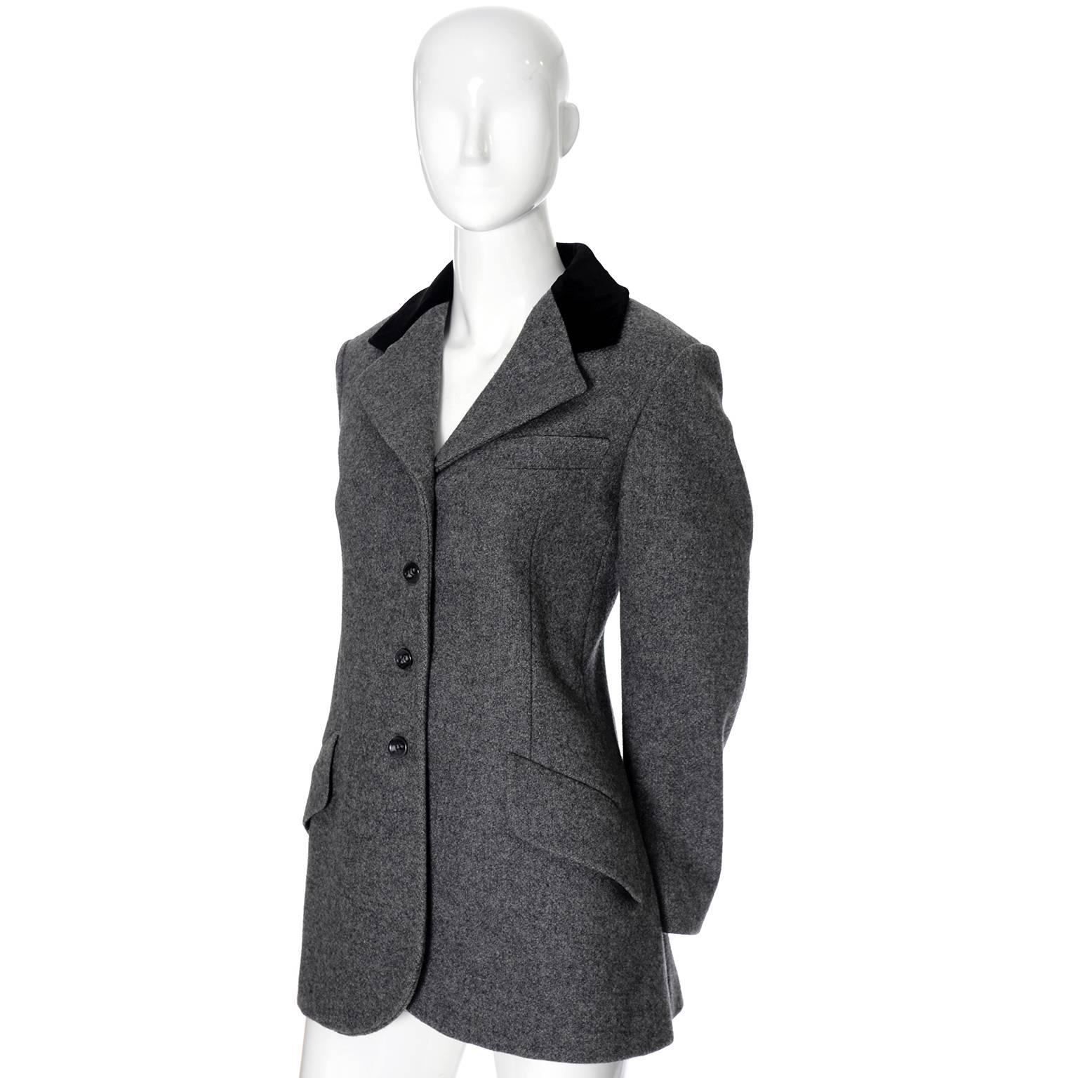 This is a gray wool vintage equestrian style blazer with velvet trim from Anne Klein. This jacket was purchased at the Anne Klein Corner of Saks Fifth Avenue in the 1970's and it is in excellent, as new condition.  The blazer has front lapel and two