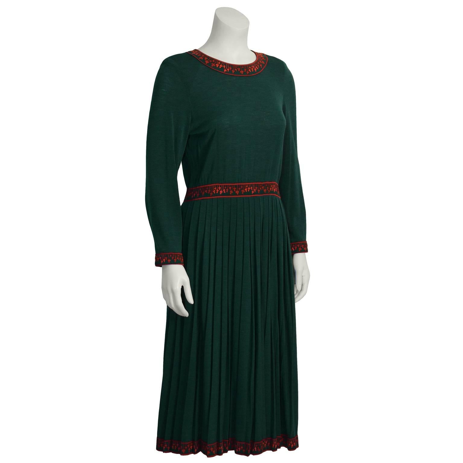 Adorable 1970's Alverado Bessi dress is a deep emerald green with a bright fushia floral design trim. Bessi was a contemporary of Emilio Pucci, best known for his printed graphic fabrics. Long sleeved knitted jersey fabric with a fitted waist, a