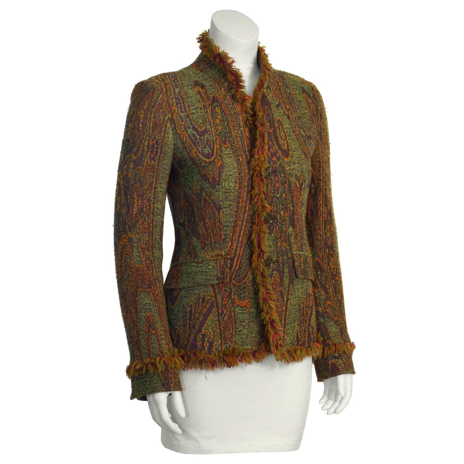 Revive your closet with this funky Etro paisley blazer with a fringe trim from the 2000's. Features front button closure, fitted through waist and two flap pockets at hip. Paisley print has notes of green, purple, yellow and orange. Lined in orange