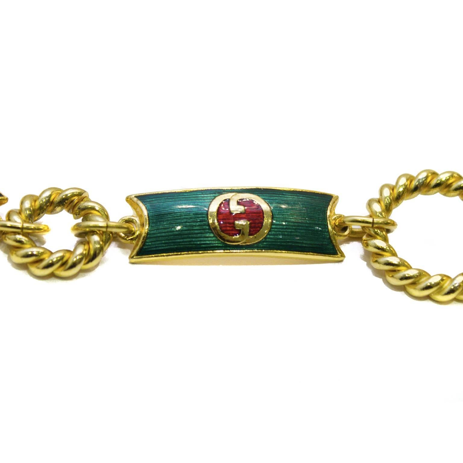 Amazing rare Gucci green, red and gold tone metal belt from the 1970's. The green enamel coats each link with the Gucci logo in its centre, in red and gold. Loop and bar allows for an adjustable waist. Excellent vintage condition.