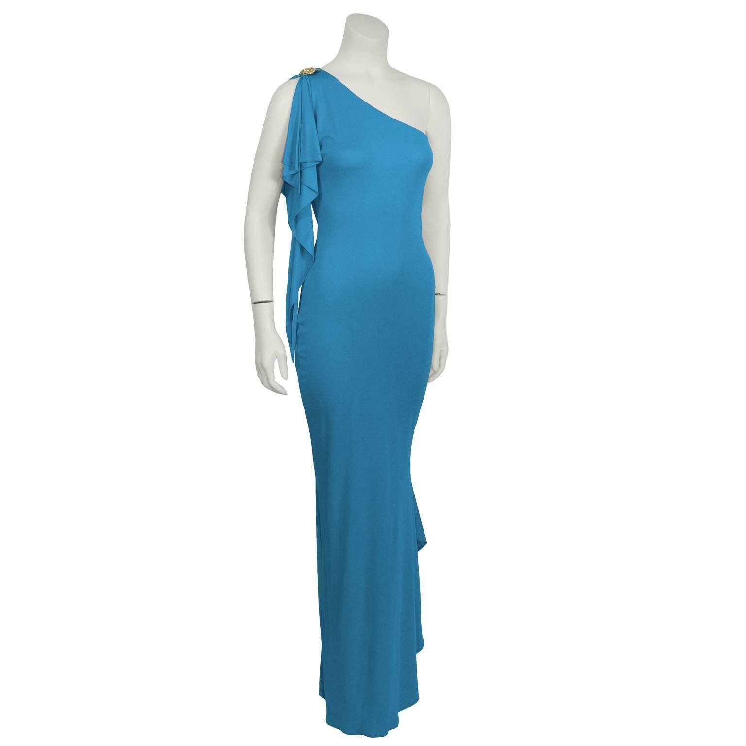 Stunning Marc Bouwer one-shoulder gown from the 2000's is a vibrant blue, with a rhinestone pin on the shoulder. Mermaid fit, with an elegant cascading tail. Side zip closure. Excellent vintage condition. 

Length 58.5