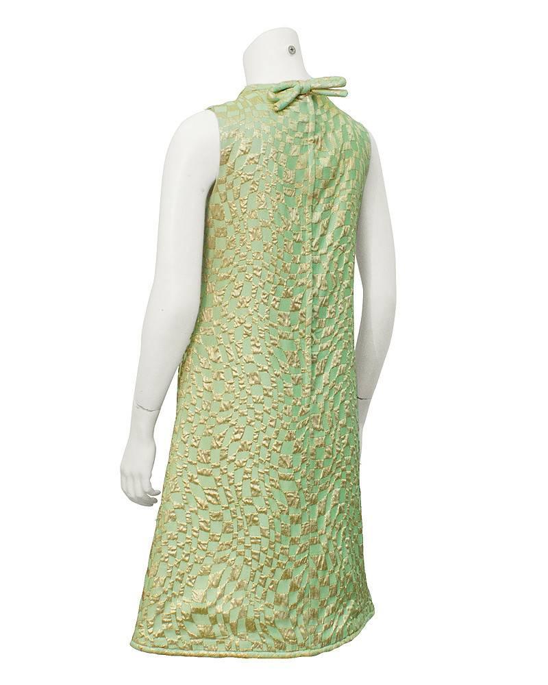 Mint green and gold Op Art pattern brocade cocktail dress from the 1960's. Typical of the newer more modern approach Suzy Perette followed after the success of the Little Black Dress that built the company.Excellent condition. Fits like a US size
