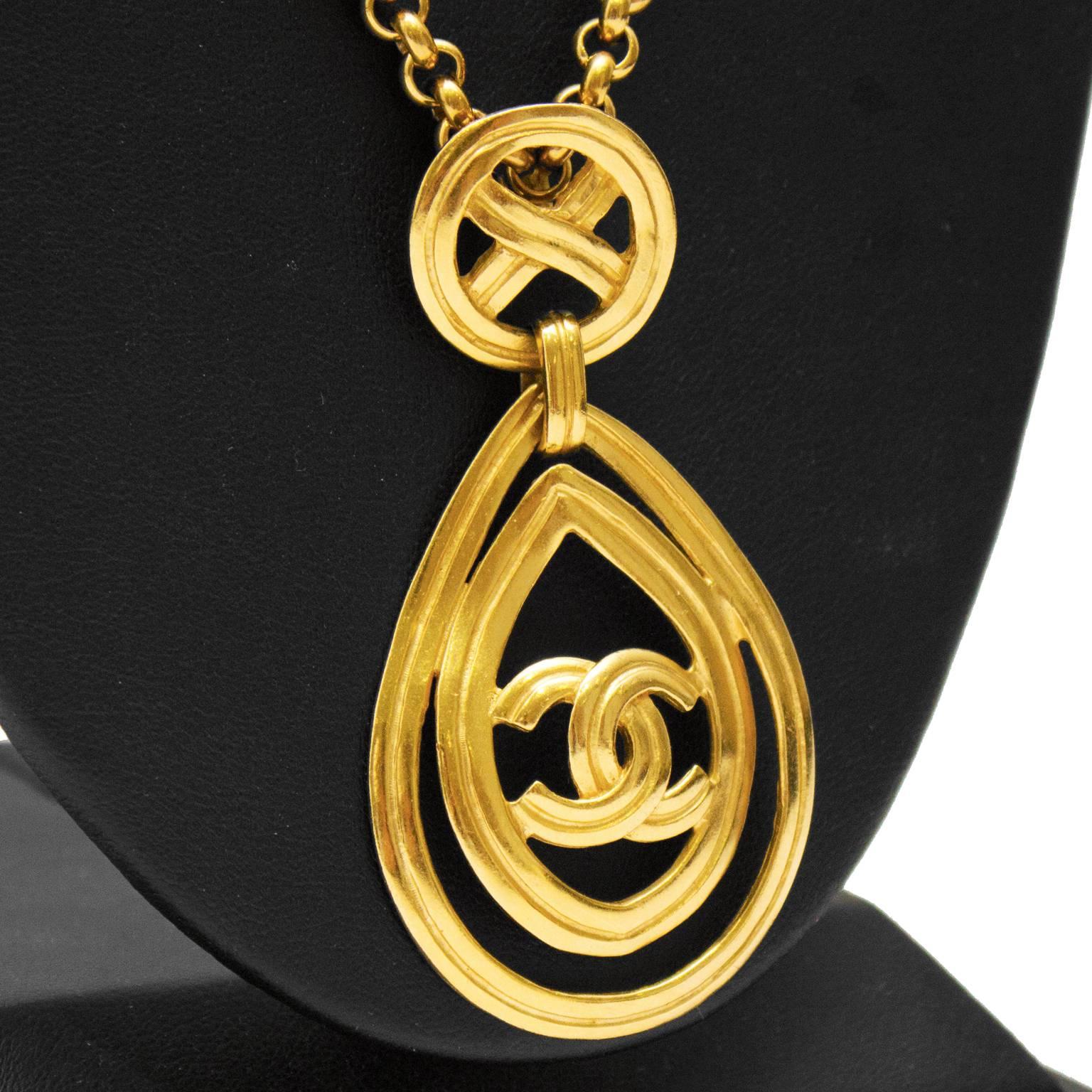 Chanel necklace with teardrop shaped pendant – Chanel long chain necklace with teardrop pendant from the 1996 Spring collection. The double teardrop pendant has a CC at the center and is linked to a round charm with an X at the center. The two