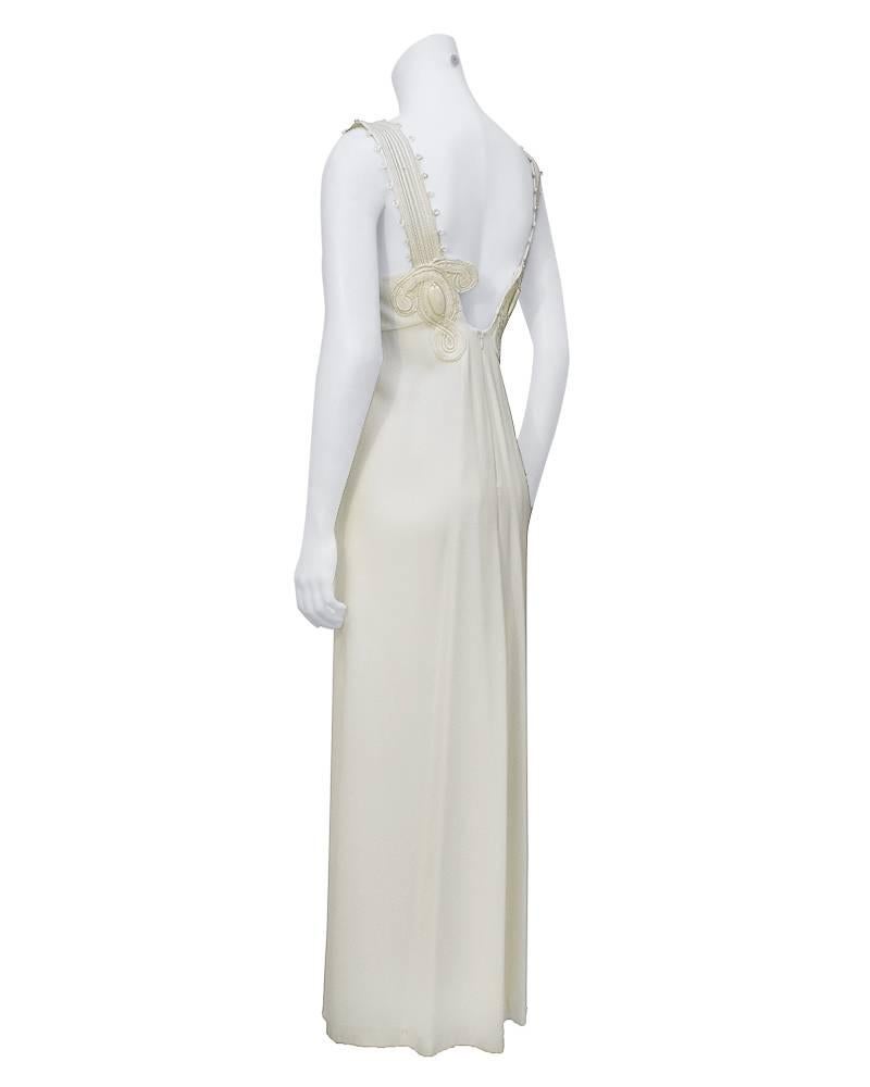 Very sexy white gown by Gianfranco Ferre from the late 1980's with intricately embellished shoulder straps featuring white passementarie cording that travels from the top of the bust down the back in a symmetrical Celtic inspired pattern, finished
