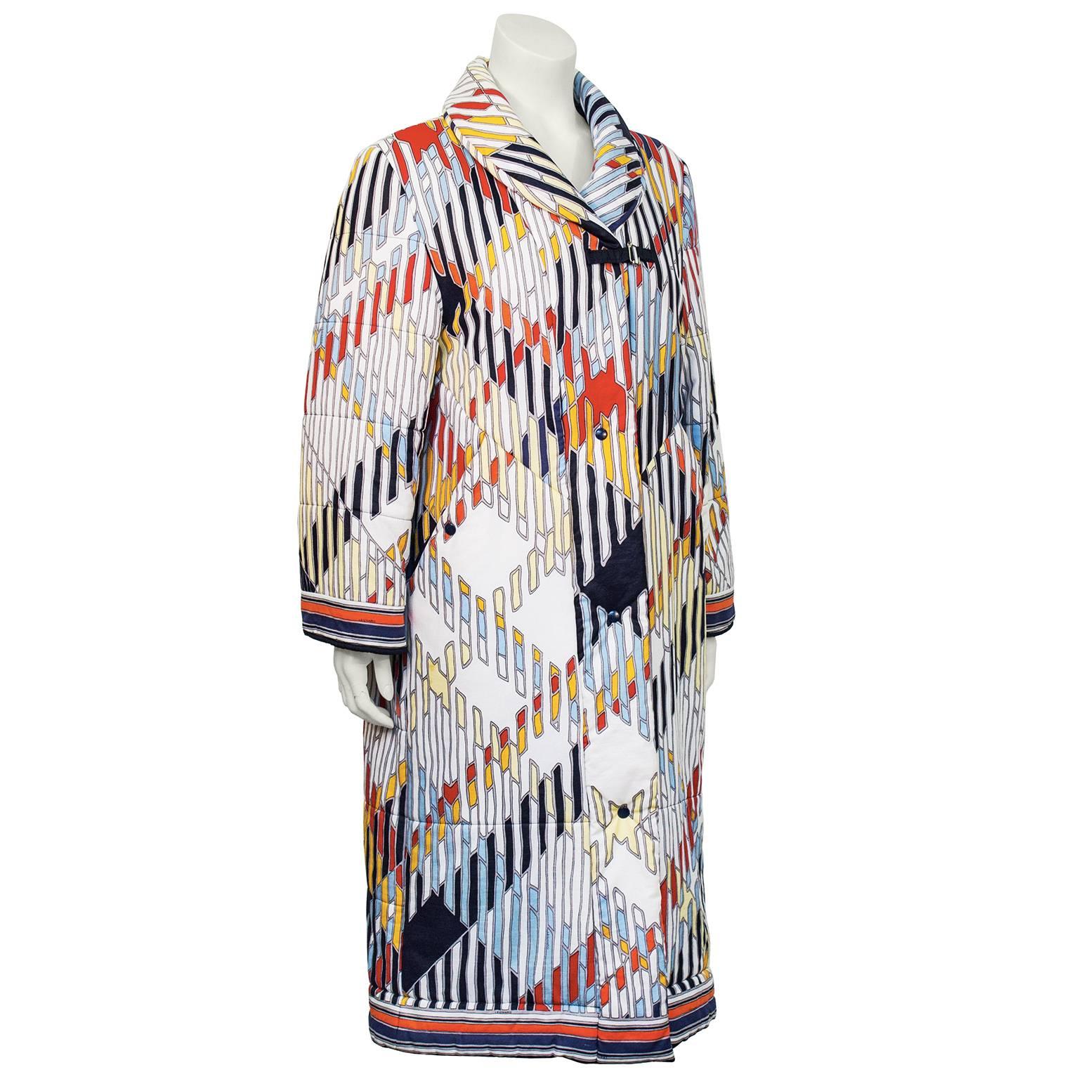 Eye catching Leonard quilted overcoat from the 1970's. In excellent condition with no signs of wear. Fastens down the front with covered snaps and a single fabric toggle below the shawl collar. Vibrant colors will warm up any fall day. Fully lined