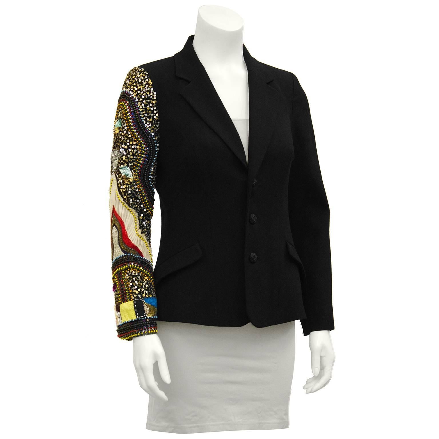 Unique Christian Lacroix jeweled sleeve jacket from the early 2000's. Classic single breasted black wool blazer with one bejeweled sleeve from shoulder to cuff. The look is simple with a twist, serious with a sense of humor. Excellent workmanship.