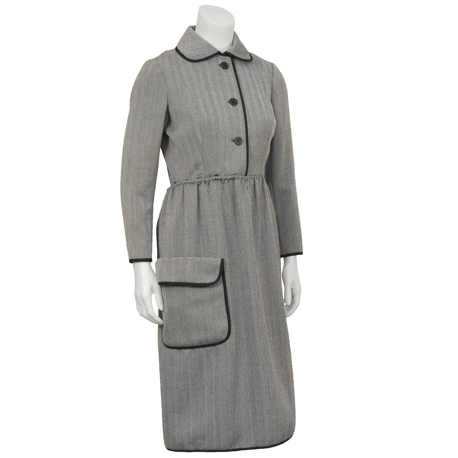 Chic 1960's Geoffrey Beene chocolate brown herring bone wool dress with exaggerated Peter Pan collar. Beautifully constructed with a series of buttons and hooks that allow the shirtwaist style skirt to wrap around and fasten in the back mirroring
