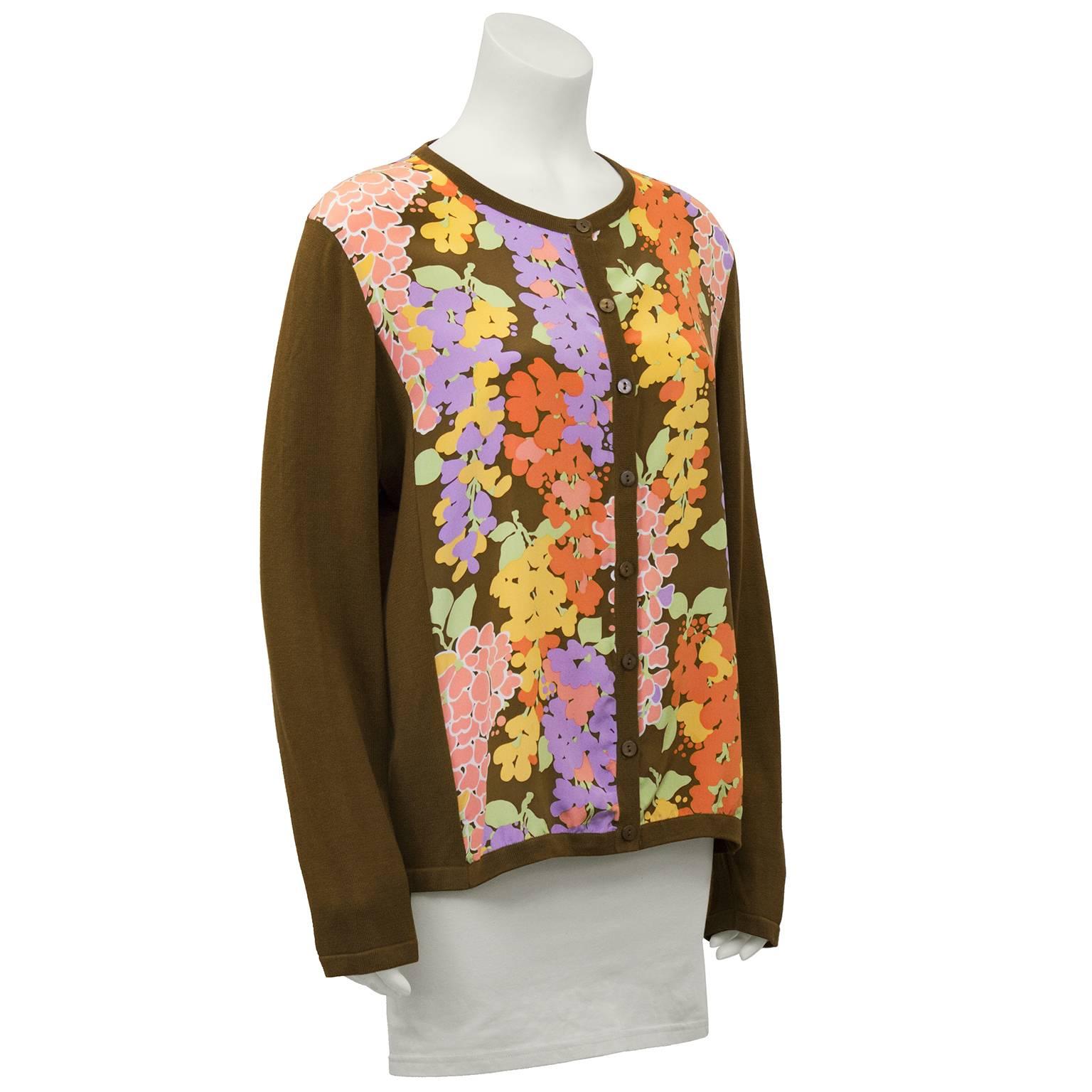 1980s Bob Mackie Wearable Art cardigan. Brown cotton knit sleeves, with a silk body featuring a colorful floral print. Interesting departure from the iconic embellished Bob Mackie gowns. Excellent vintage condition. Fits like a US 8. 

Sleeve