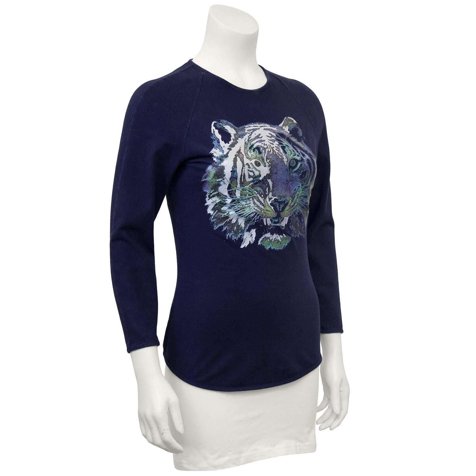 Circa 2000 navy blue cotton and elastine Chloe top featuring a tigers head graphic in white, blue and an iridescent green. Shirt is baseball style with 3/4 sleeves and curved hem. Size M, excellent vintage condition. These are part of her late