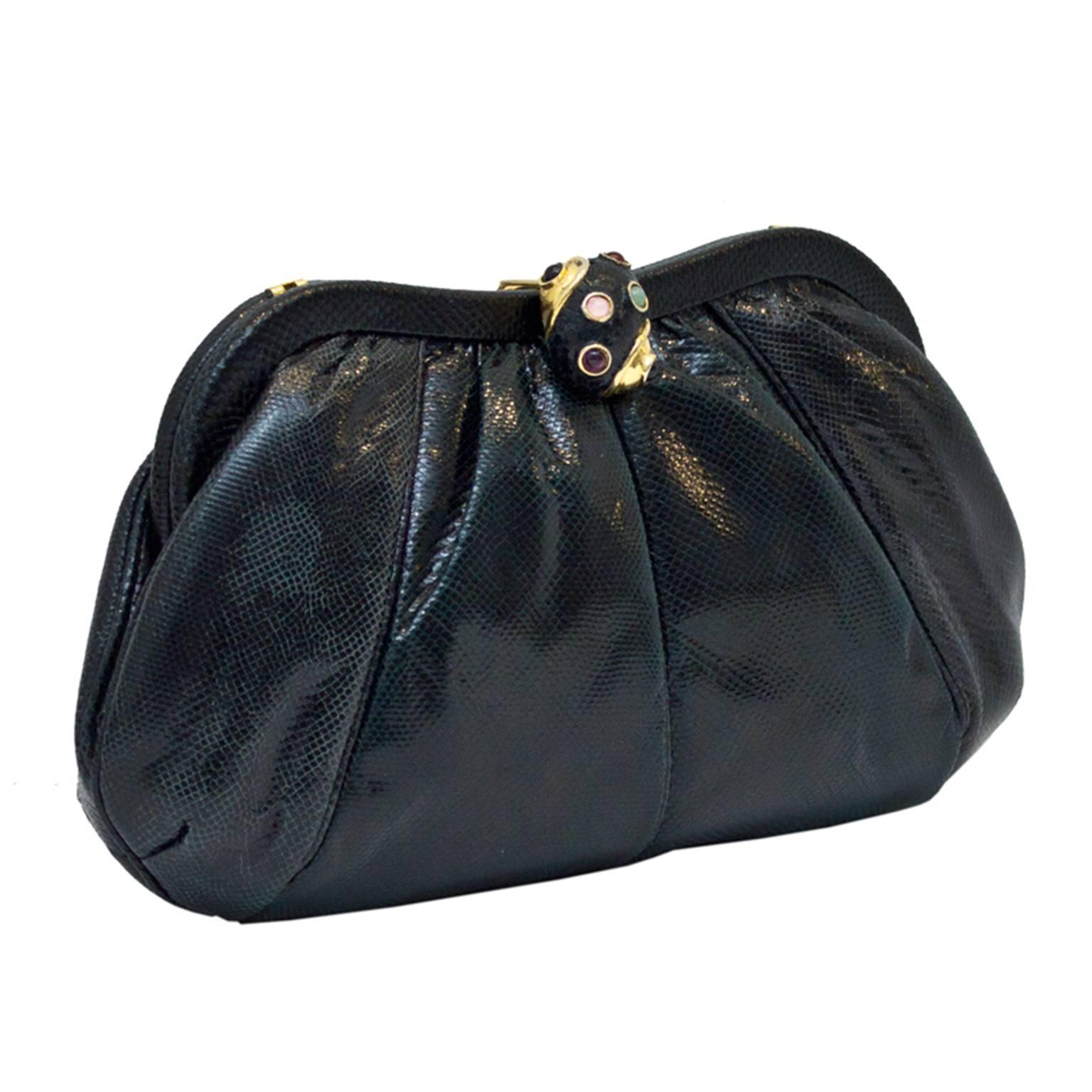 The best evening bag for your dollar. Classic python Judith Leiber clutch with cabochon studded python covered clasp. Leather interior, very good vintage condition.

Length 8.5