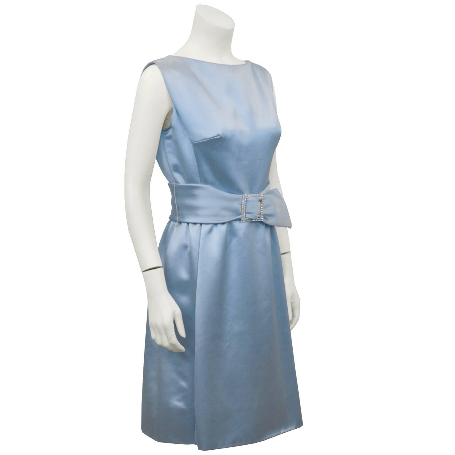 Adorable baby blue silk satin cocktail dress by Suzy Perette, dating from the 1960's. Beautiful boat neckline and matching blue satin wide belt with rhinestone encrusted buckle. Very Cinderella. Excellent vintage condition. Fits like a US size 6.