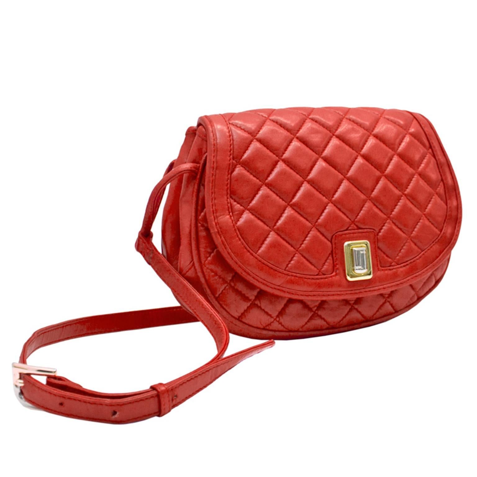 Vintage Judith Leiber butter soft red quilted lambskin cross body shoulder bag. Dates from the 1980's with gold plated hardware and full leather lining. More day bag than evening, this bag is a luxury item finished with the finest details.