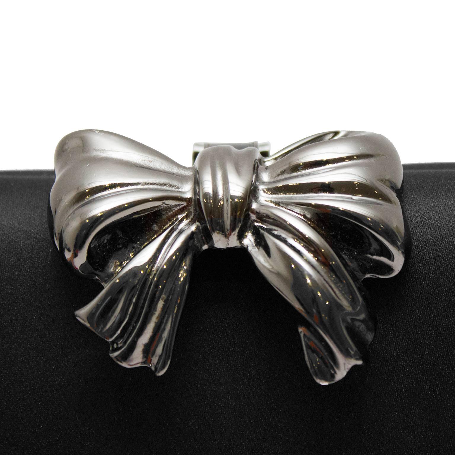 Women's 1980s Rodo Black Satin Clutch with  Metal Bow Detail  For Sale