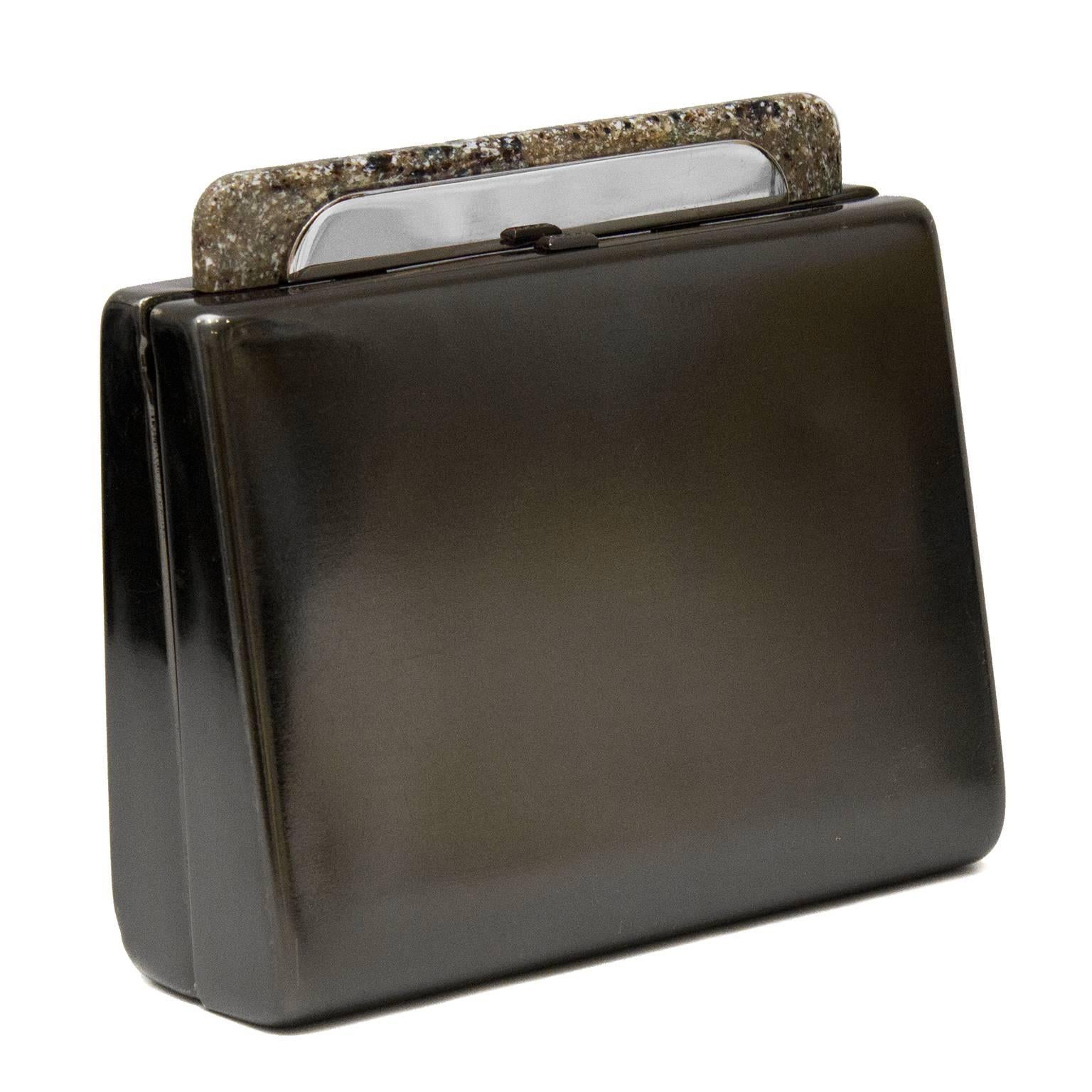 Pewter hard case minaudiere Rodo clutch dating from the 1980s with interesting faux granite detailing at clasp. Light wear throughout. Metallic silver leather interior with small pocket - clean, with minor wear. 21