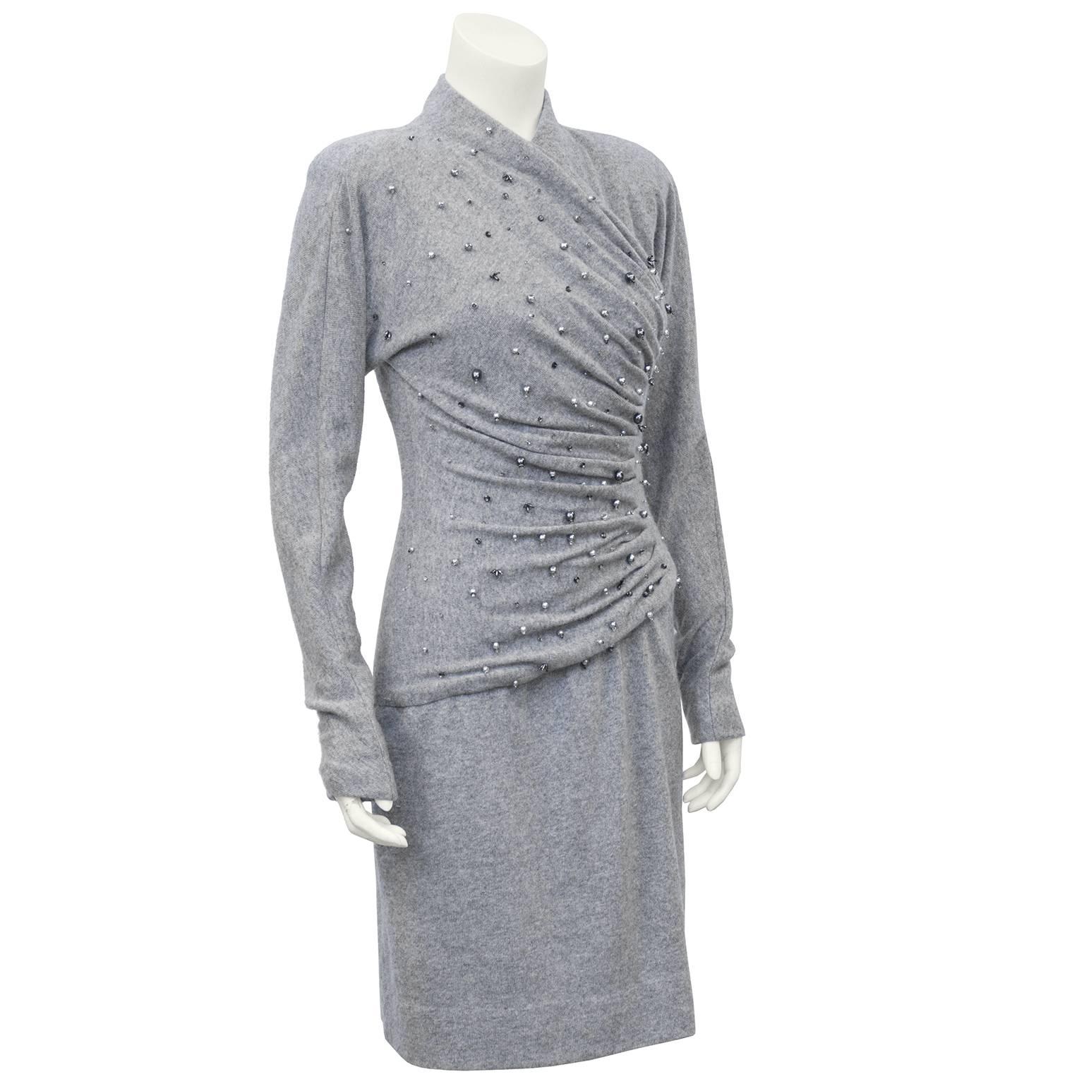 Cozy and sexy Carolyne Roehm grey cashmere dress with figure flattering ruching. Dolman sleeves and greyish silver faux pearl beads throughout bodice, creating beautiful embellishment. Large shoulder pads that can be easily removed. Luxurious and