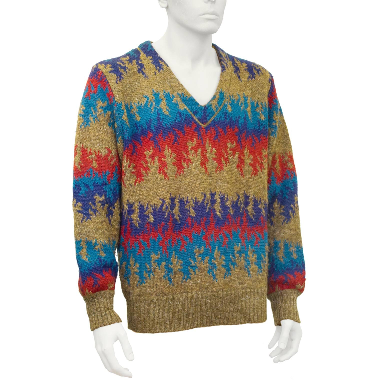1970's Missoni mens V neck sweater in classic flame chevron pattern. Rich tobacco, blue, turquoise  and red wool and alpaca knit. Fits like a mens S-M and a ladies US 8-10. Excellent condition.

Sleeve 23