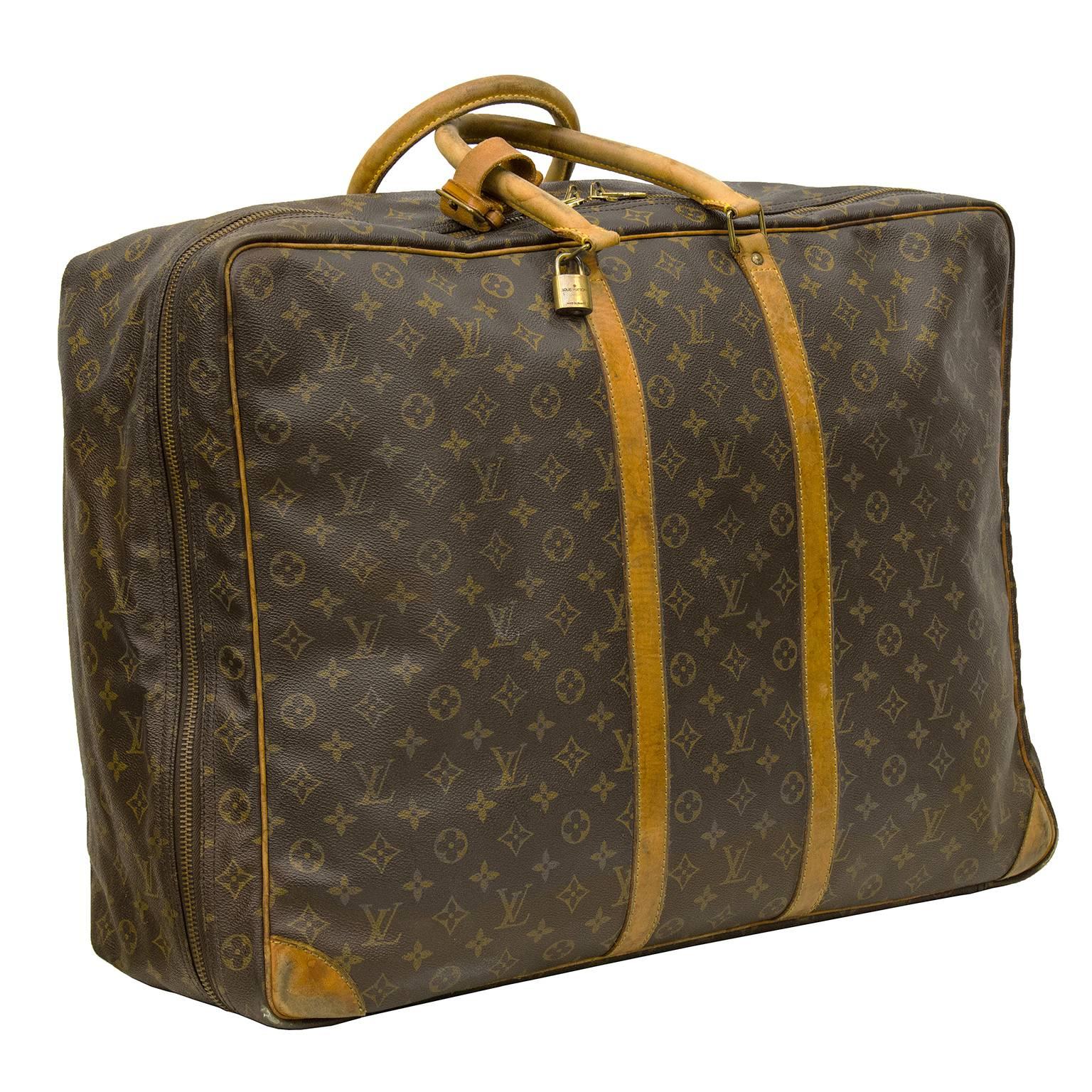 Travel in style with this ultra chic Louis Vuitton Sirius 60 suitcase; large enough to hold all the essentials on a long trip. This Louis Vuitton Monogram Canvas Sirius 60 single compartment soft suitcase is the second largest member of the Sirius
