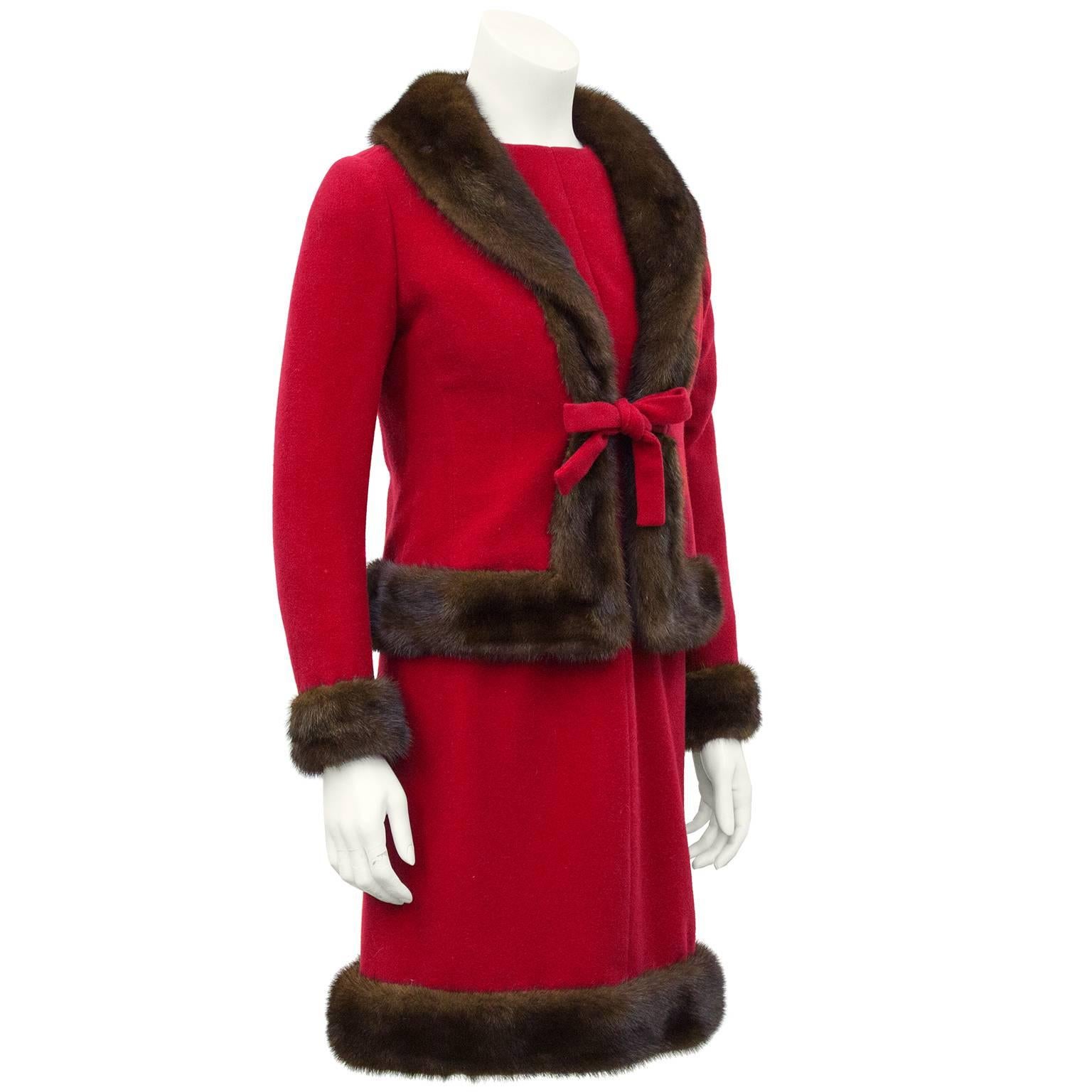 Stunning 1960's Nina Ricci haute couture red wool dress and jacket ensemble with mink trimmed hem. The dress has sheer silk chiffon long sleeves and is fitted through the waist and bodice. Jacket features a mink trimmed shawl collar, hem and cuffs