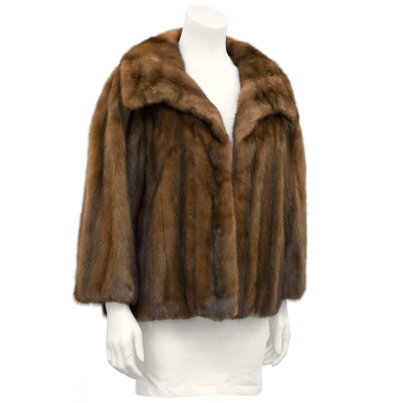 Beautiful 1960's Christian Dior Original brown mink short jacket made for prominent Canadian luxury department  Holt Renfrew. Features an oversized collar, a large invisible hook and eye closure, bracelet length sleeves and slit pockets. Grey silk