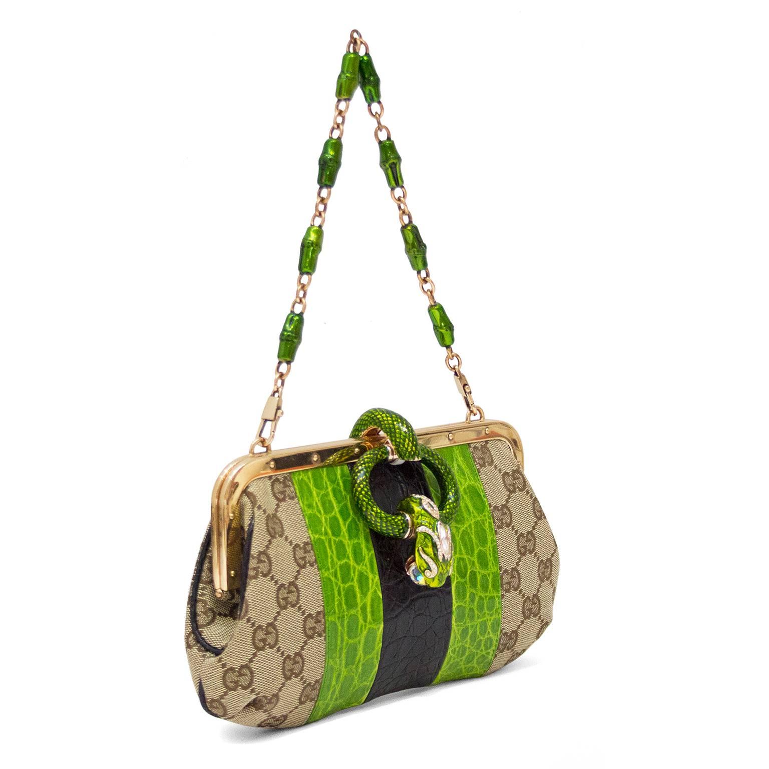 Limited edition evening bag from the Gucci by Tom Ford Spring/Summer 2003 collection. Constructed of panels of the iconic Gucci monogram canvas with black and green crocodile. Rose gold tone hardware with green enamel and metal bamboo shaped accents