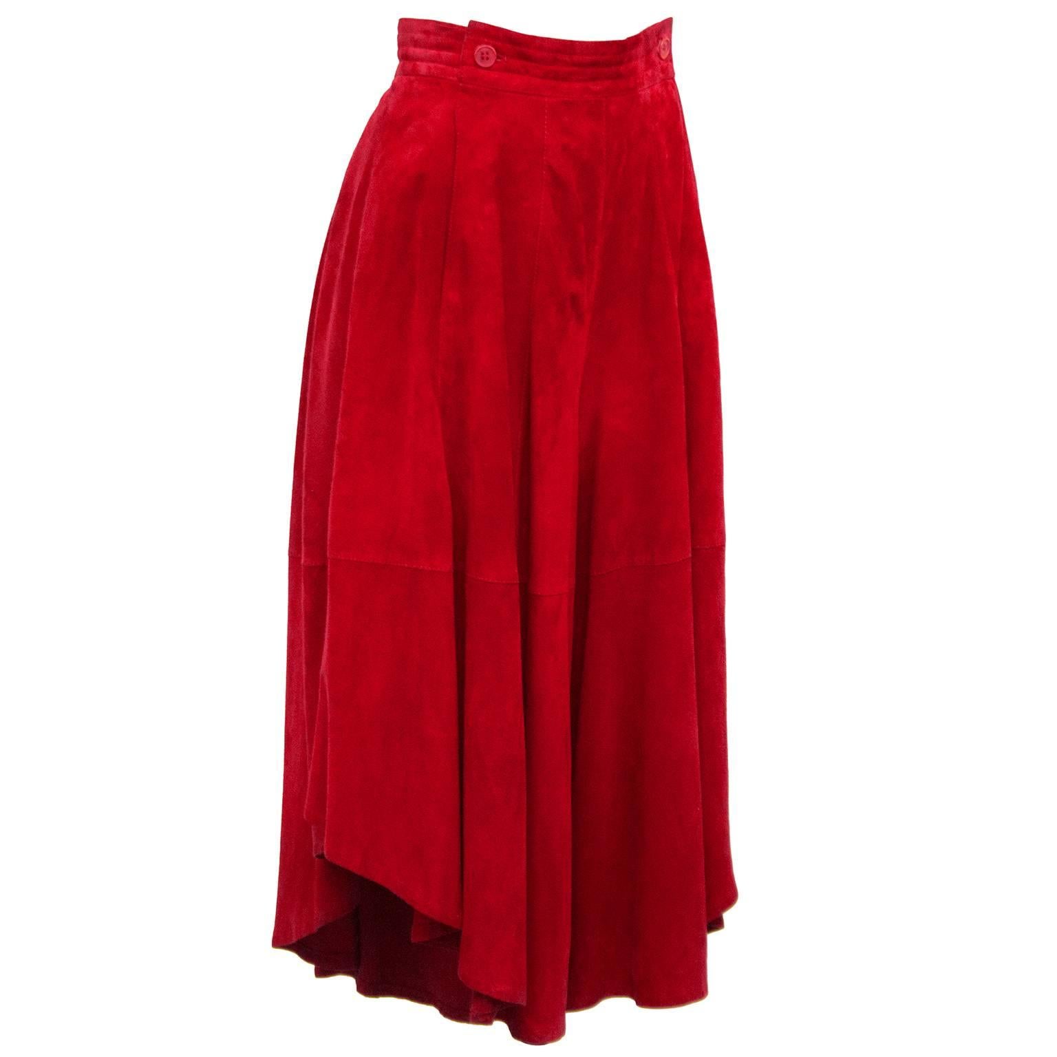 1980s red Gianfranco Ferre suede culottes. Slits up both legs to allow for draping to look like a skirt. Sailor fly with hidden zippers and two red buttons. Side slit pockets. Red viscose lining. Marked US size 4. Excellent vintage condition.

Waist