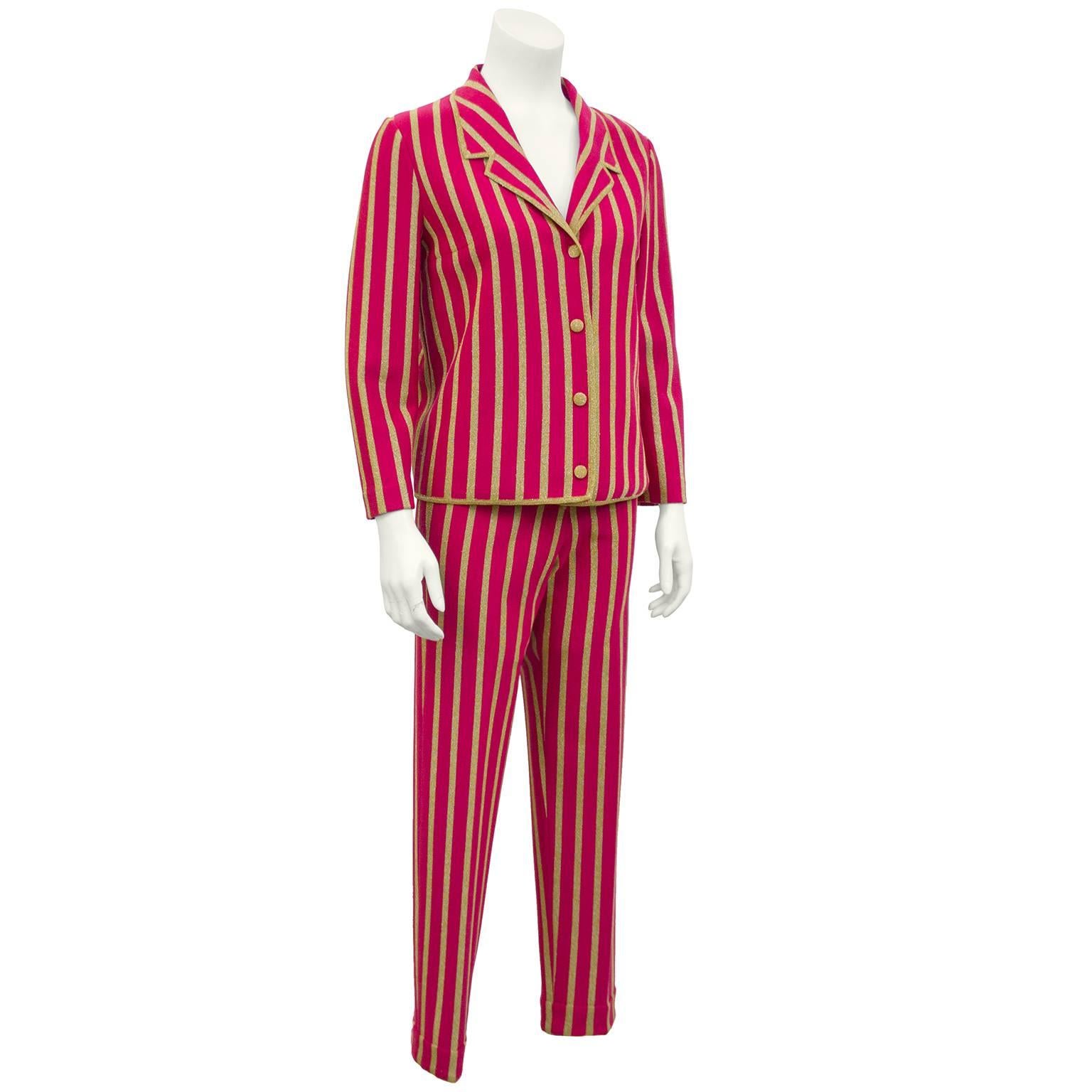 1960s raspberry and gold lurex vertical stripe 3 piece wool knit suit by Italian knit wear designer Gino Paoli. Light jacket with matching gold lurex buttons. Pants have an elastic waist, front button and zipper fly, centre pleats and bottoms are