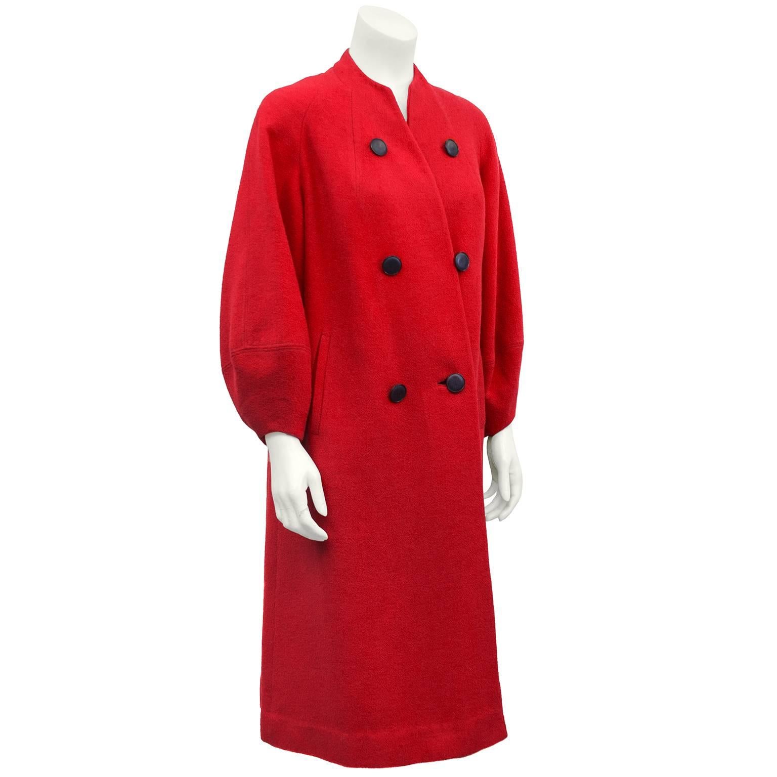Great 1950s red faux double breasted wool coat cut diagonally, the first button does not do up, second button has a button loop on the seam and the bottom button has a button hole. Collarless, with very small v neck and balloon sleeves. In excellent