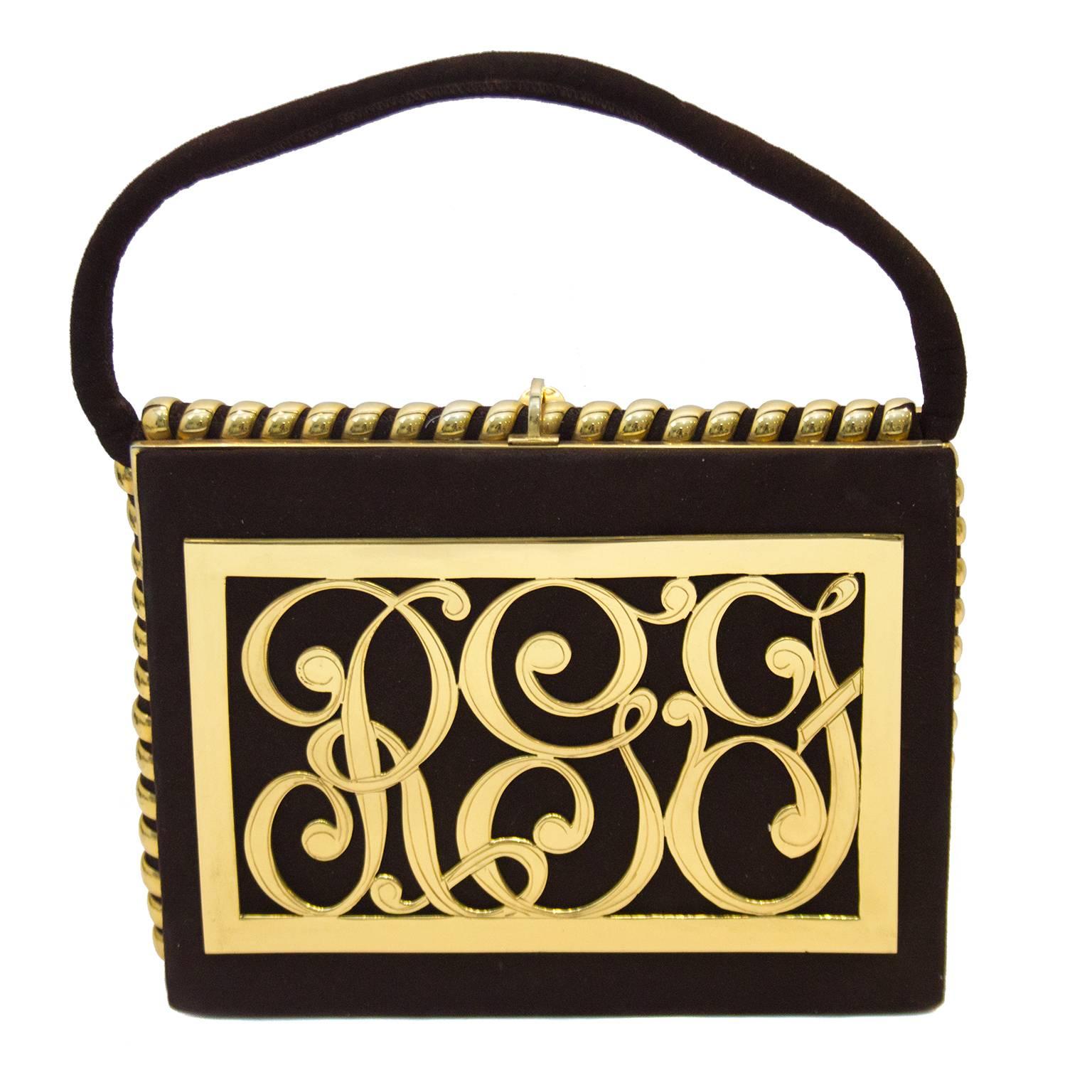 Interesting 1940s brown doe skin evening bag with gold tone cut metal large initials R.G.F. Spiral gold tone metal trim. Cream satin interior with suede trim. In its day this was a luxury item of extraordinary quality custom made for the client and