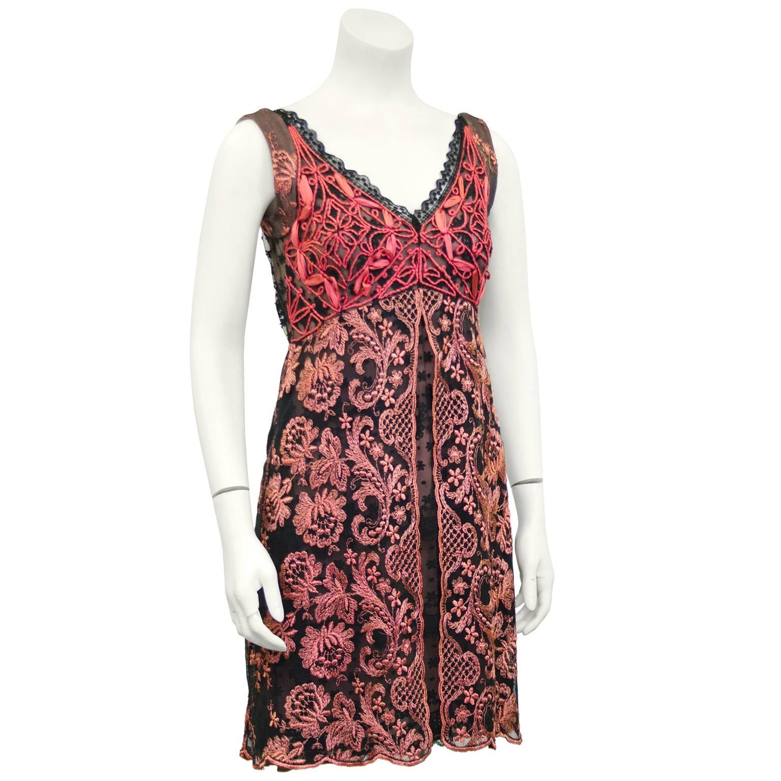 Beautiful 1990s Christian Lacroix guipure floral lace cocktail dress. Dress is sheer with a pink silk lining showing through. Black with bright pink lace on bodice and light pink on skirt. Excellent vintage condition. Fits like a US 2-4. Original