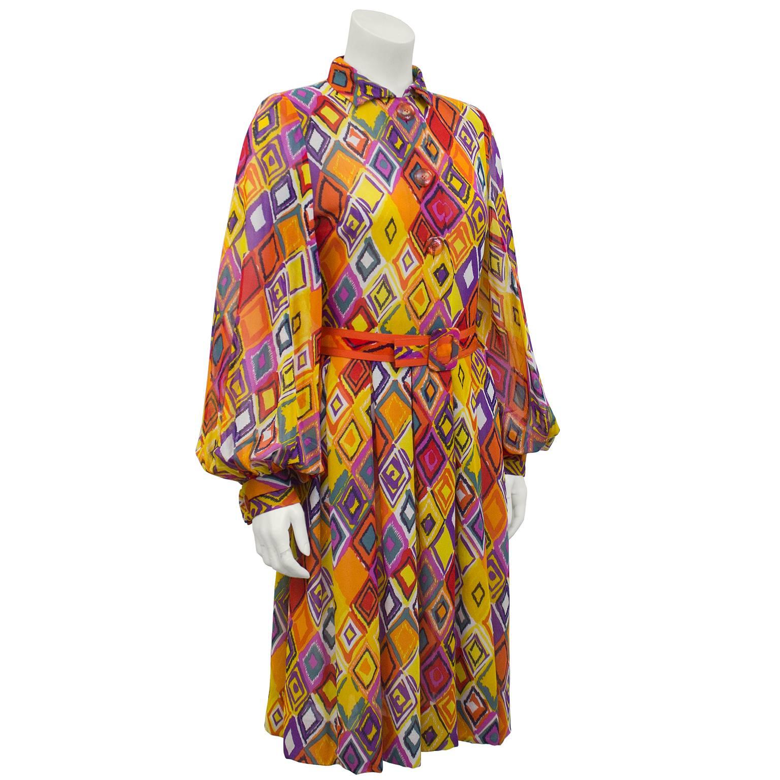 Pauline Trigere multi-colour diamond print fine cotton shirt dress. Large transparent orange plastic buttons, matching belt at waist and slightly gathered at cuff. Excellent vintage condition. Perfect resort getaway piece, folds into any carry on.