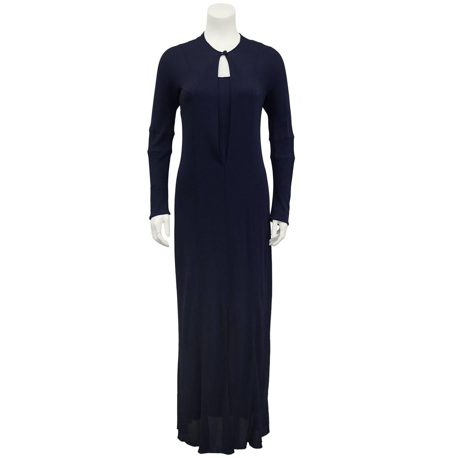 1990s Karl Lagerfeld navy blue jersey gown ensemble. Featuring a mini slip dress under a long sleeve gown with a large key hole at bust finished off with a single button closure. Excellent vintage condition. Fits like a US 4. 

Sleeve 22