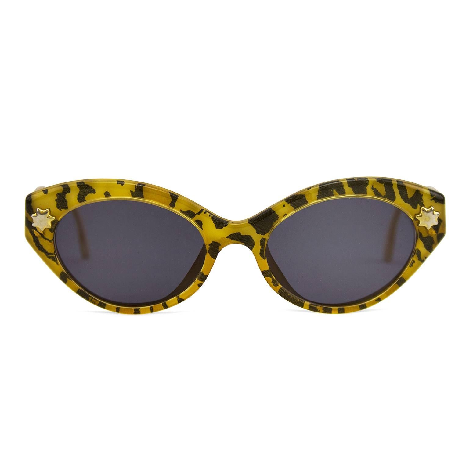 1980s Christian Lacroix cat eye shaped leopard print sunglasses. Small gold star and logo details. Cream interior with black brand stamp. Brand new black/grey lenses. Excellent vintage condition. No case. 