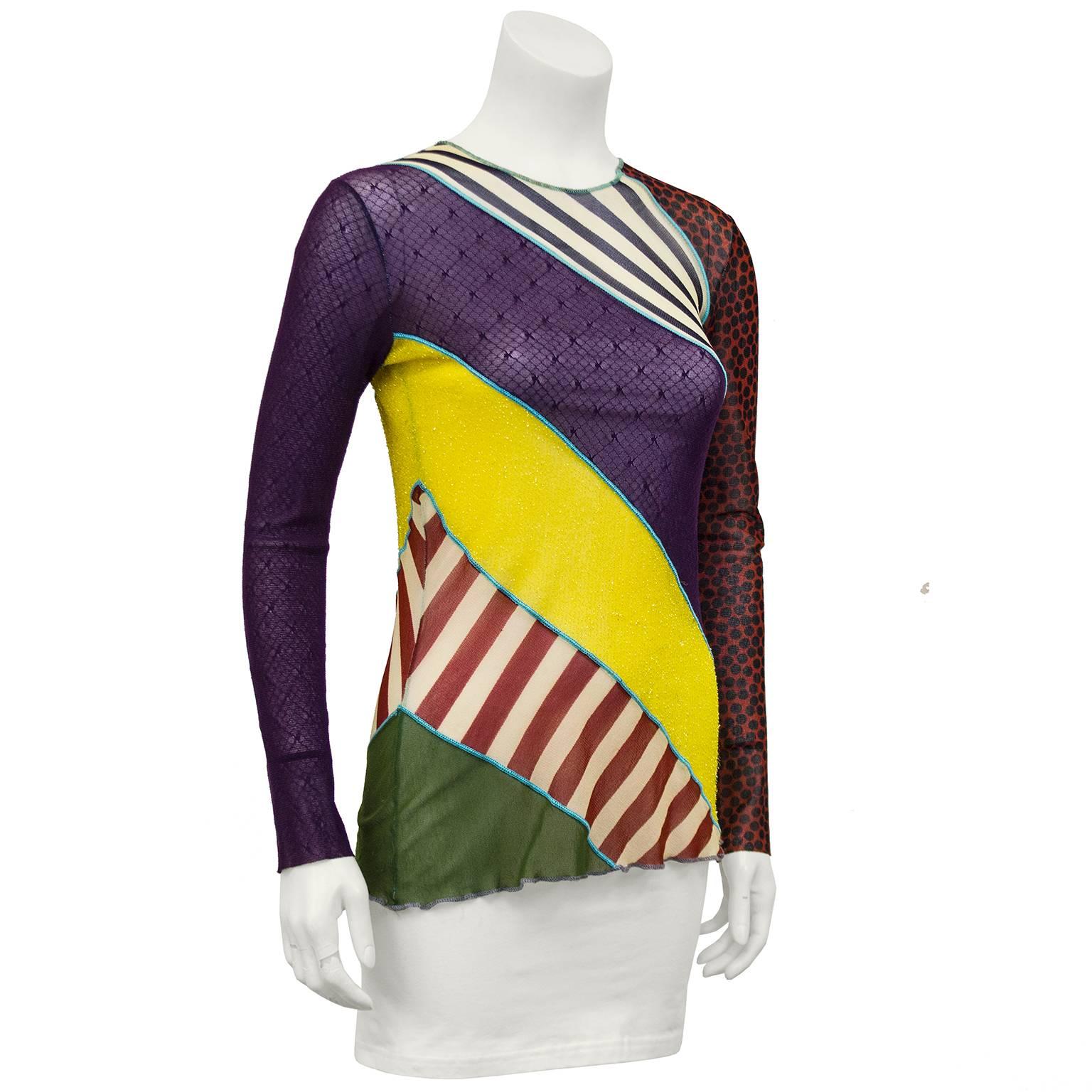 Jean Paul Gaultier long sleeve top from the early 2000s. Interesting mix of fabric, colour and patterns on a diagonal bias. Sheer. Excellent vintage condition. Fits like a US 4 - some give, fabric is elasticized. 

Sleeve 22