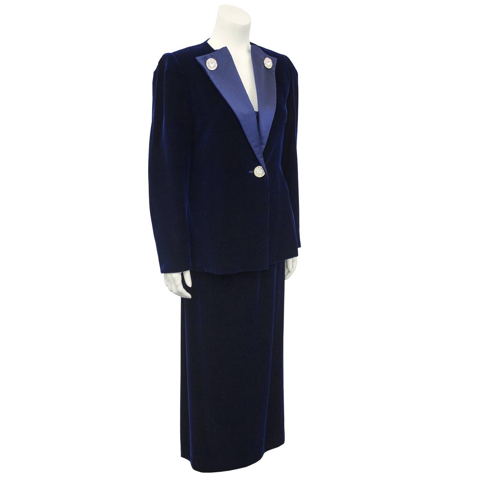 1970s three piece navy blue ensemble by Canadian demi couture designer Maggie Reeves. Velvet blazer with a silk lapels, embellished rhinestone button details and matching single button closure. Blazer has beautiful floral lace cut out with hand