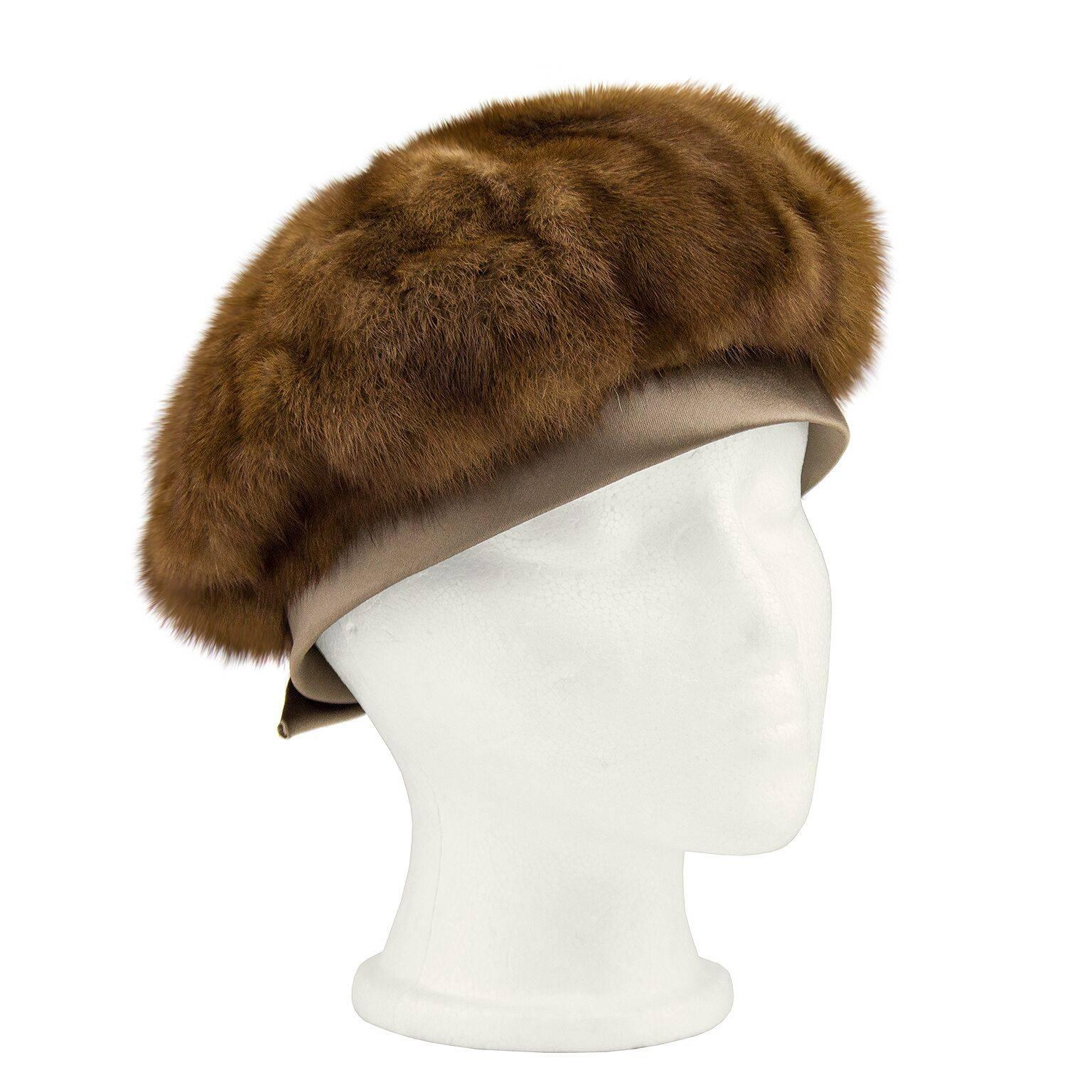 1960s mink beret from a Toronto based designer. Taupe silk ribbon detail around the perimeter with a bow detail at the back. Excellent vintage condition, the mink has been preserved extremely well. Very wearable and perfect to kick up your winter