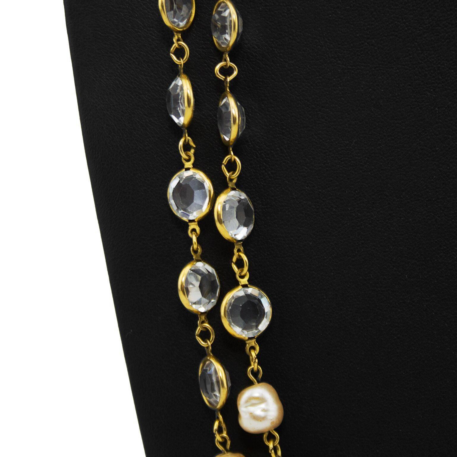 Beautiful and highly collectable long Chanel sautoir dating from 1981. No clasp, goes over the head and can be worn long or layered. Clear cut crystal and faux pearls in a gold tone metal setting. Small circular gold Chanel tag with markings.