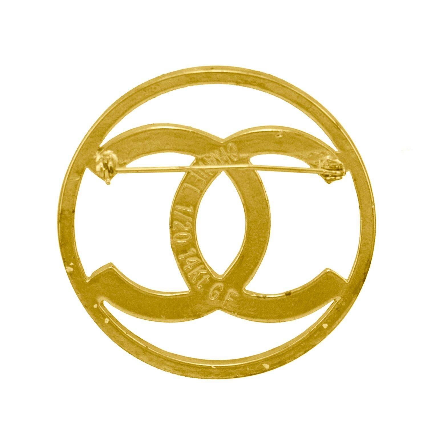 Chanel large circular cc logo pin dating from the early 1980s. 14 karat gold filled, very rare for Chanel jewelry, most being gold tone metal. Excellent vintage condition. Perfect addition to a Chanel jacket or great to amp up a modern denim jacket.