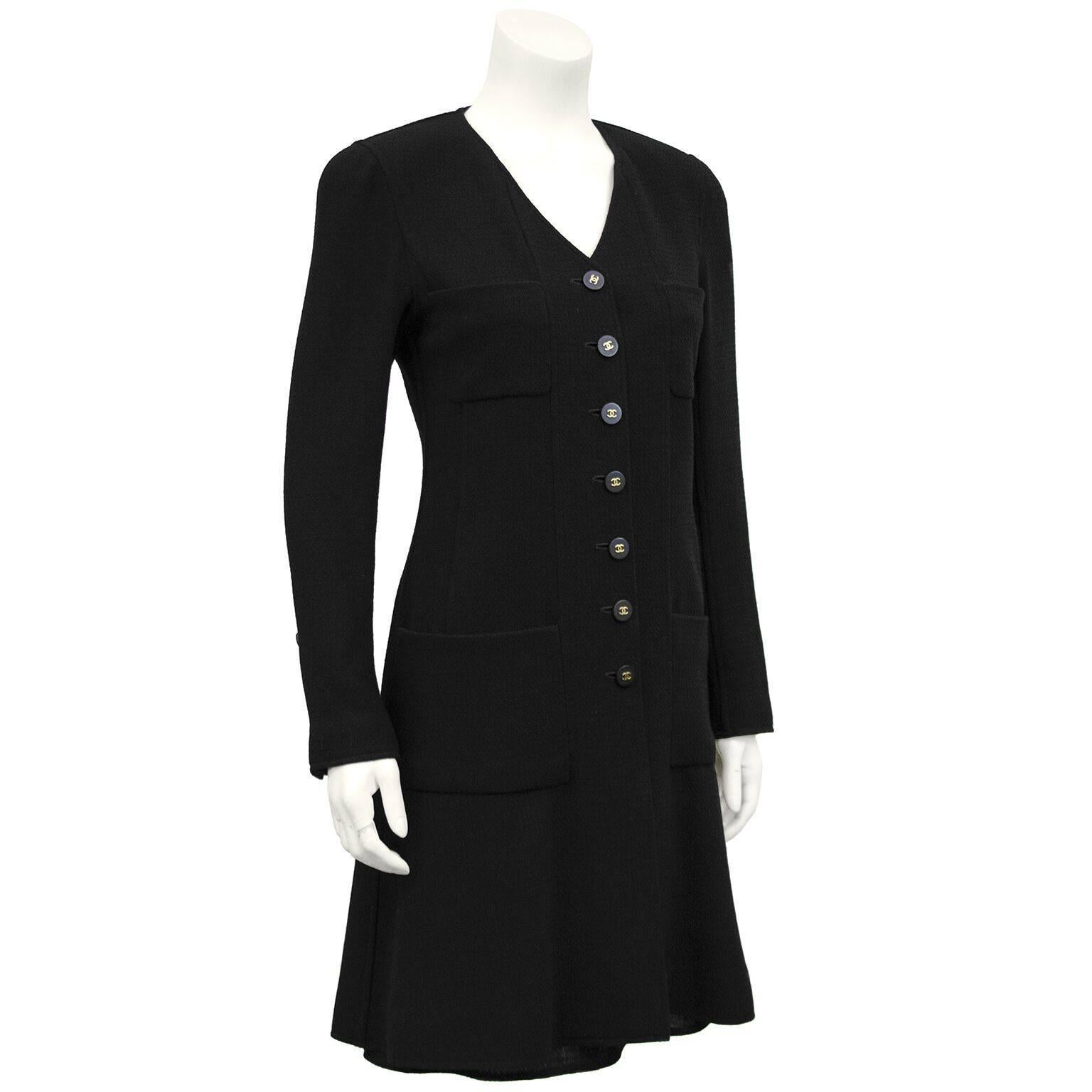 Chanel wool crepe ensemble from the autumn 1994 collection. Black coat dress with 4 patch pockets. Black and gold cc logo Chanel buttons down centre front and on cuffs. Matching black wool high-waisted mermaid style skirt under coat dress. Great,