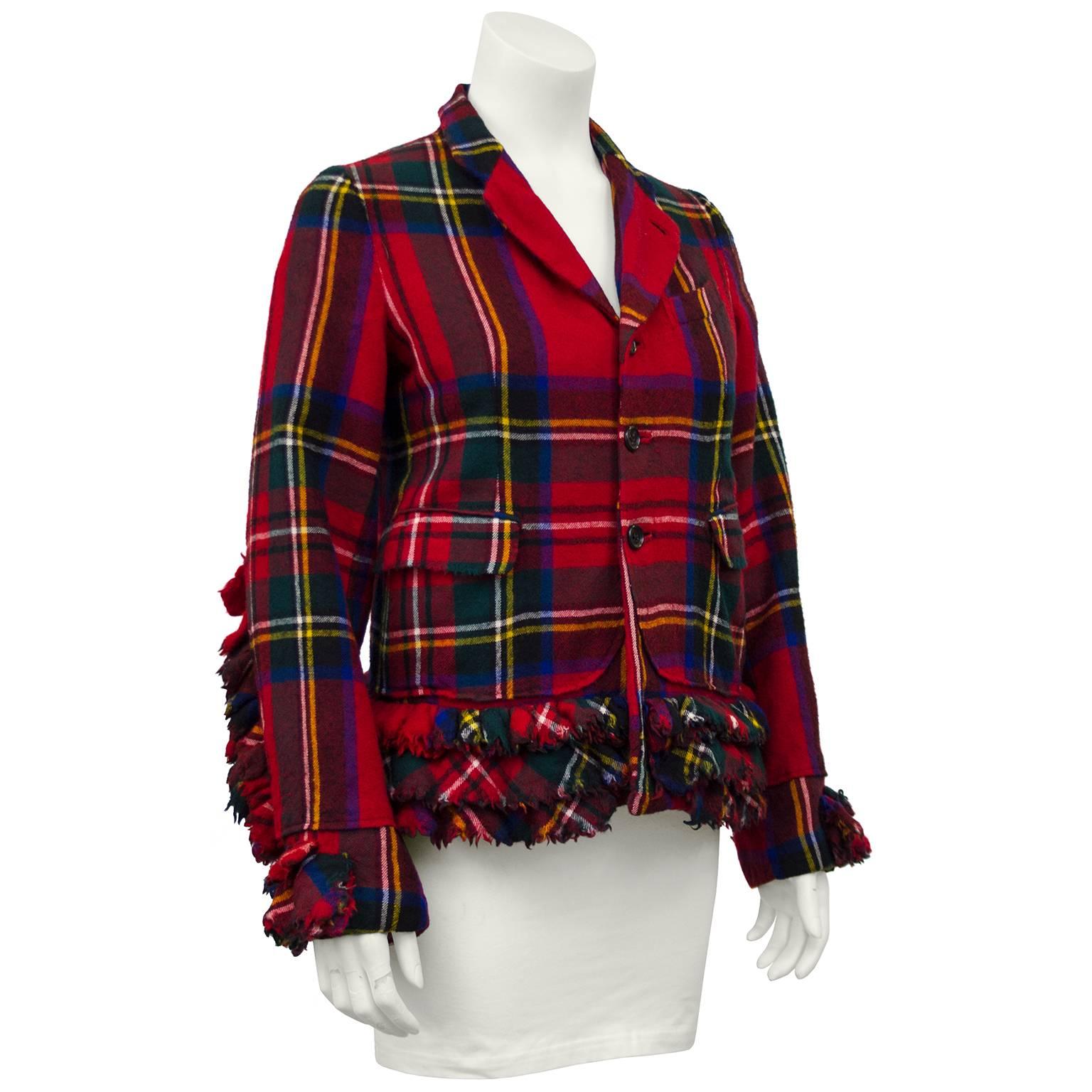 Fabulous early 2000's red tartan Commes Des Garcons jacket with 3-D ruffles framing the cuffs, hem and down the center back. Can be worn open collar or buttoned up for raised Mandarin style collar two side pockets with flaps, fully lined interior.