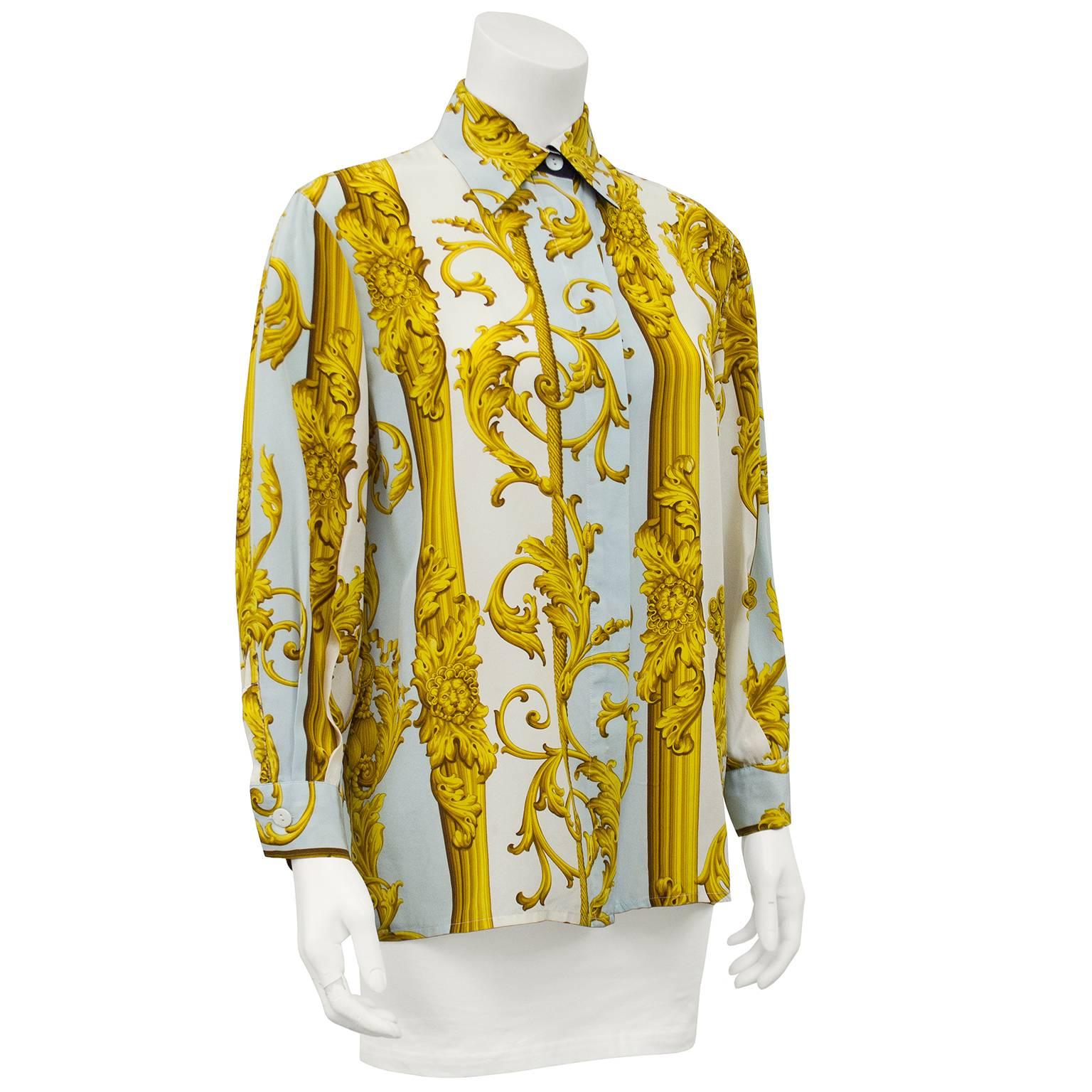 Stunning Studio 0001 by Gianfranco Ferre silk ladies shirt with button front, collar and cuffs. A look that defined the era, luxury fabrics printed with opulent baroque designs in cream, blue and gold tones. Very Versace in its graphic style. In